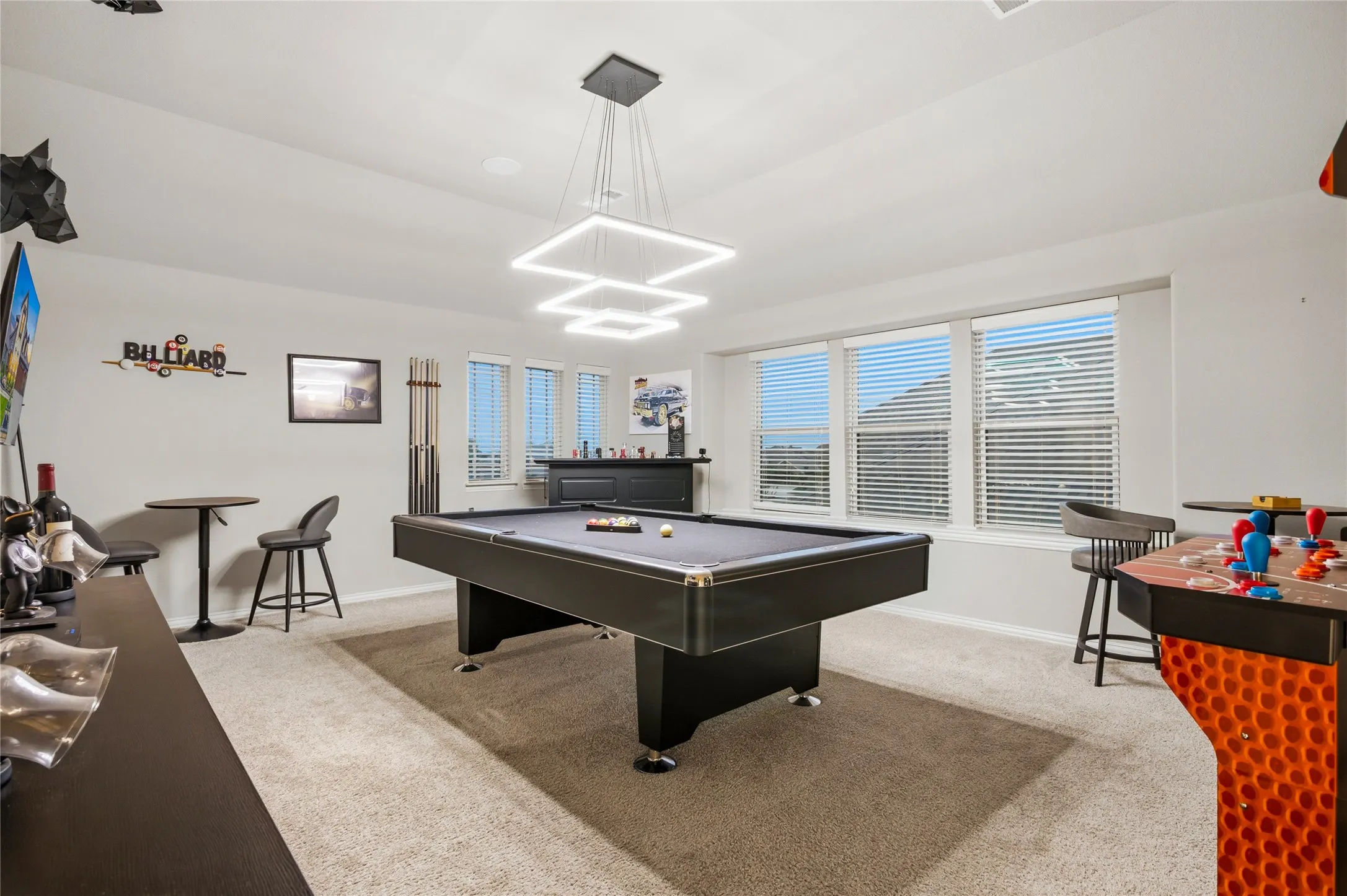 The game room has lots of natural lighting.