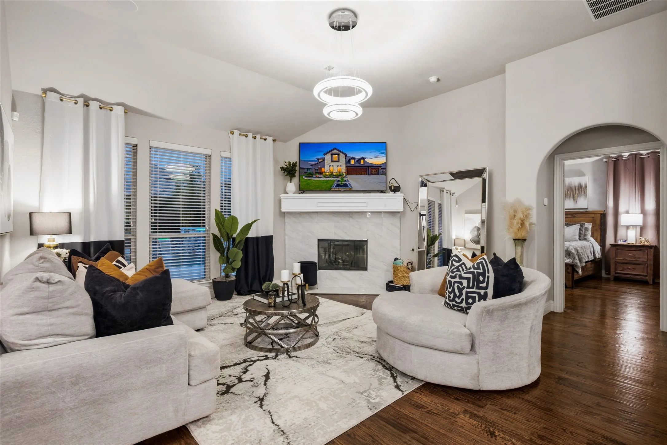 The living area is open to the kitchen and both cozy and beautiful.