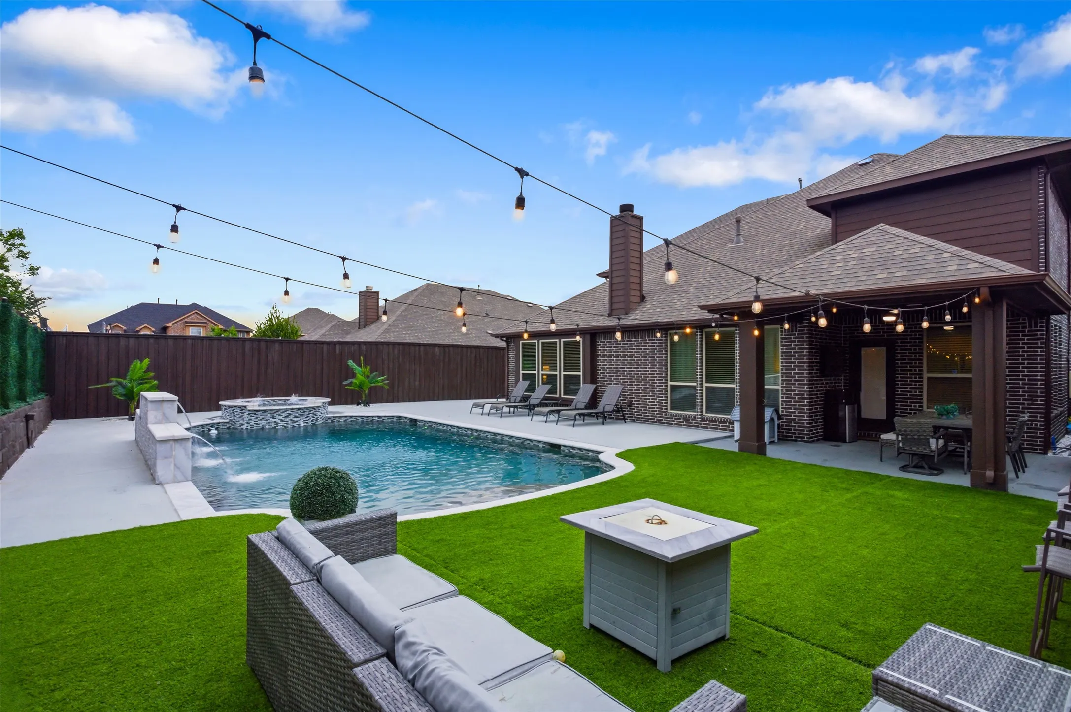 Pool area with view of the home