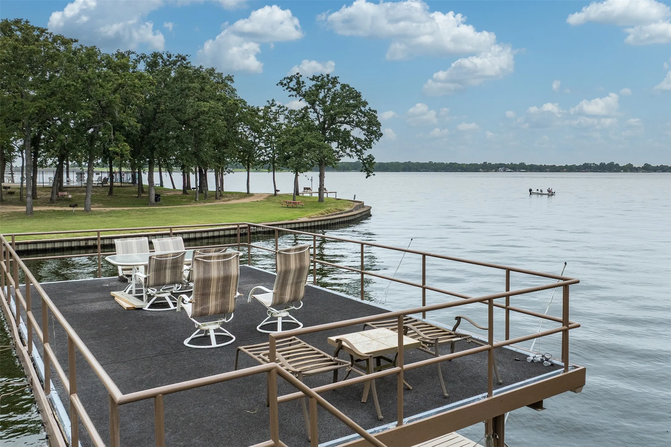 Private dock with railing, providing direct water access