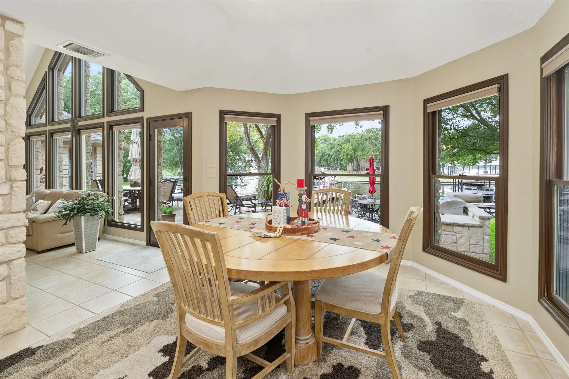 Dining area featuring a circular wood table and tile flooring