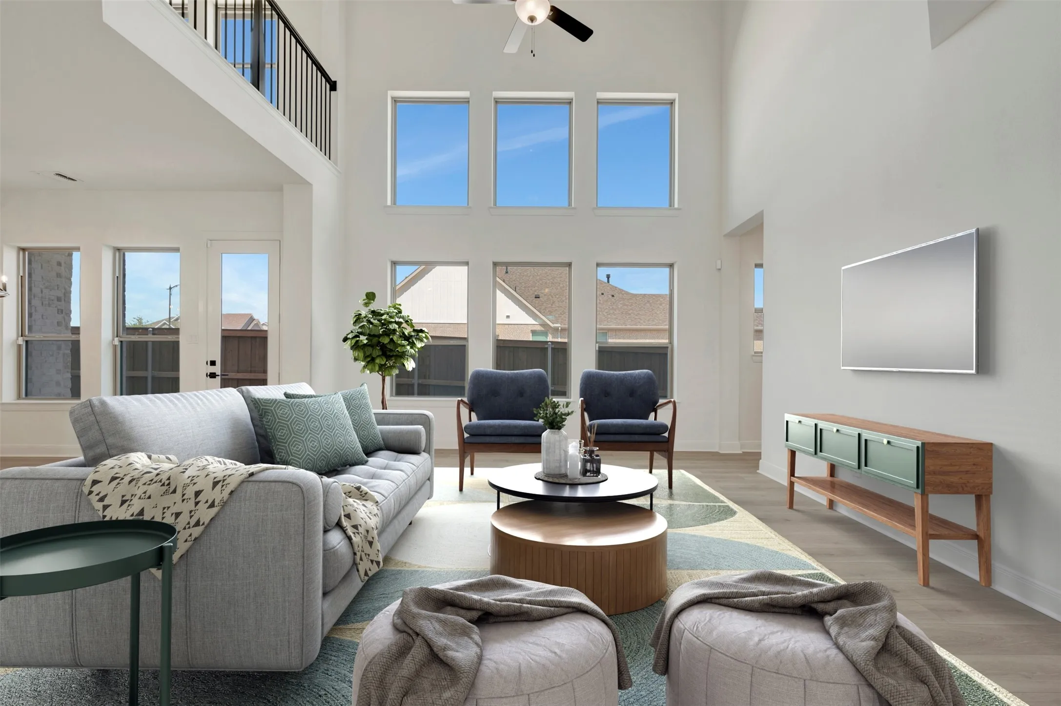 Soaring ceilings and abundant natural light define this expansive space
