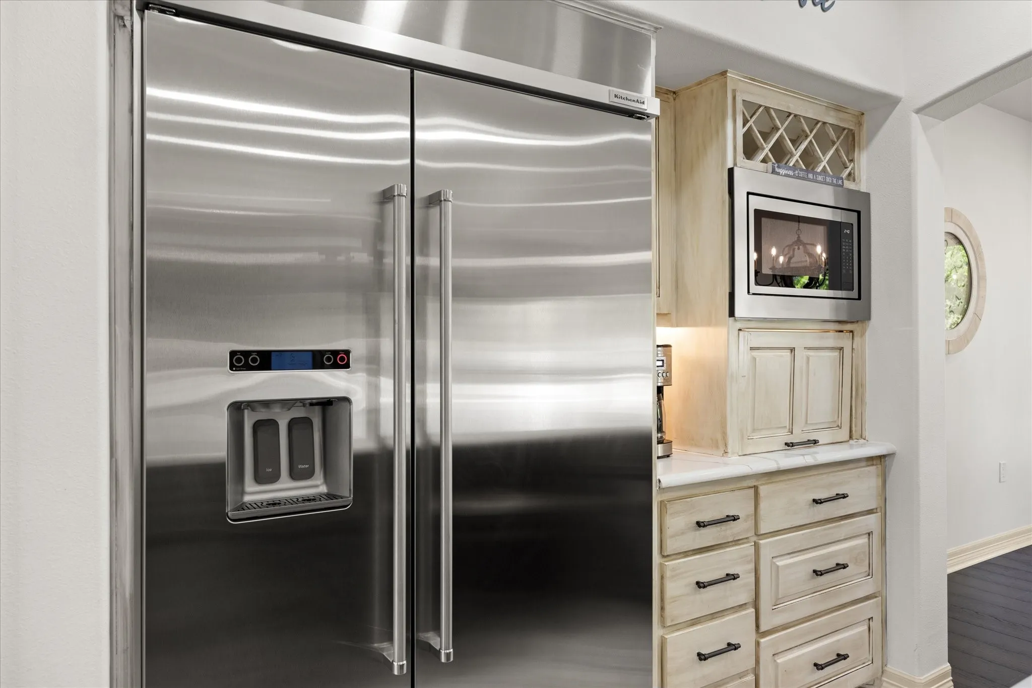Stainless steel side-by-side refrigerator with exterior ice and water dispenser