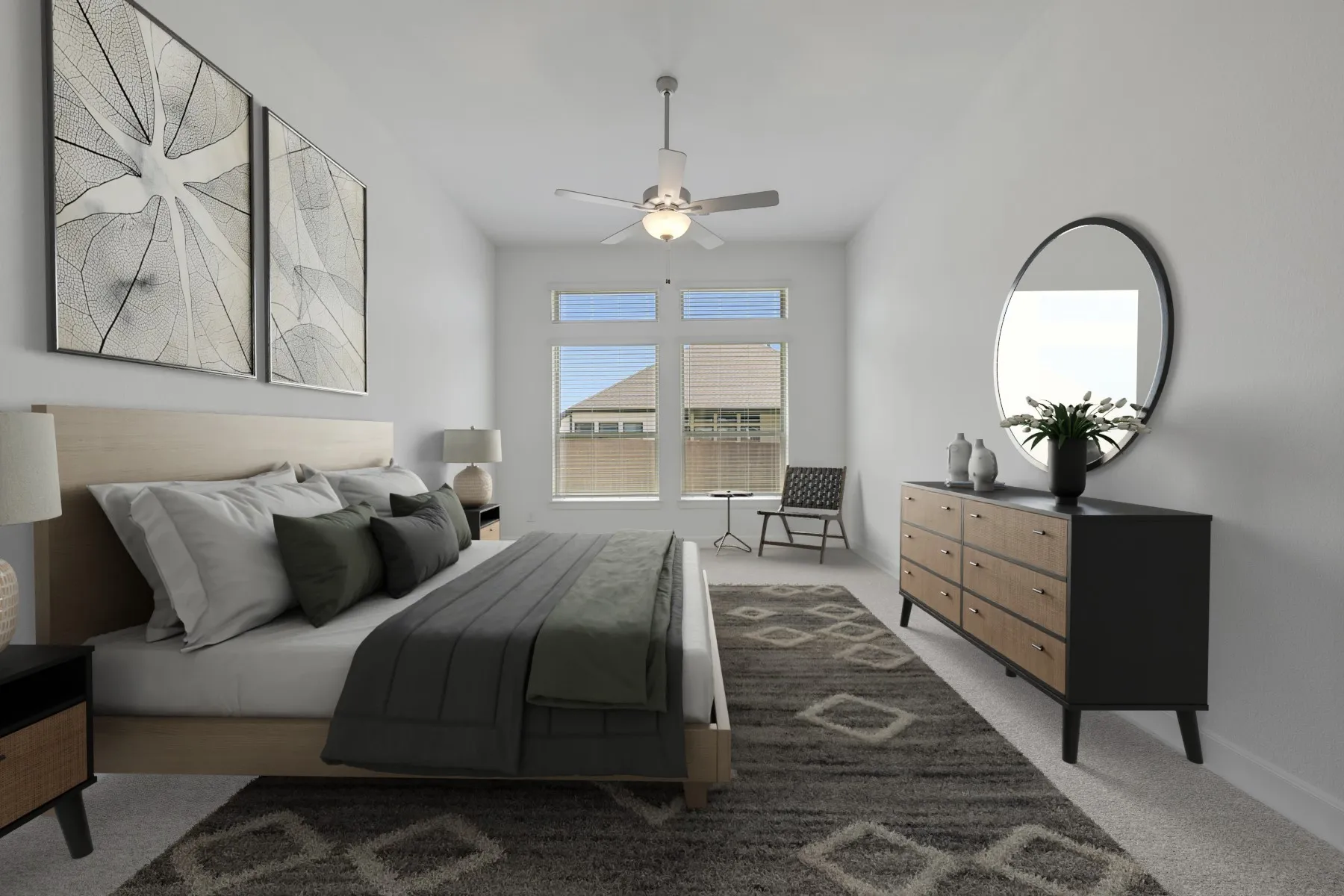 Spacious bedroom featuring light-colored walls, a vaulted ceiling, and a ceiling fan with integrated lighting