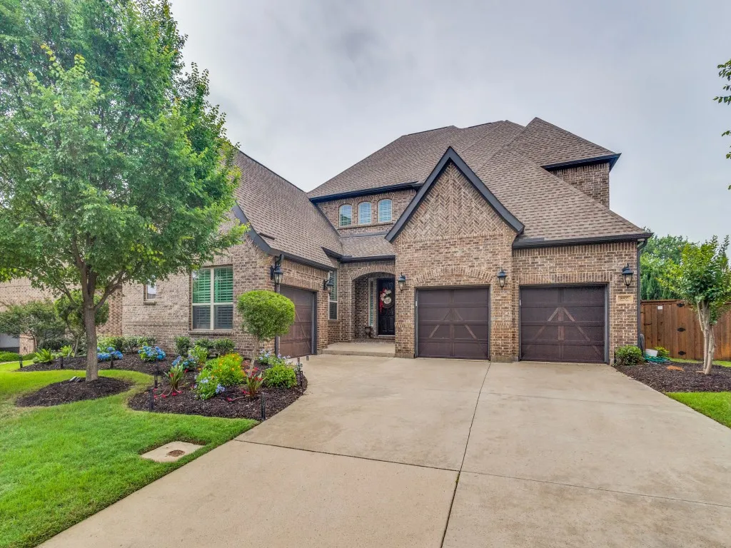 Brick exterior with dark trim and a multi-gabled roofline