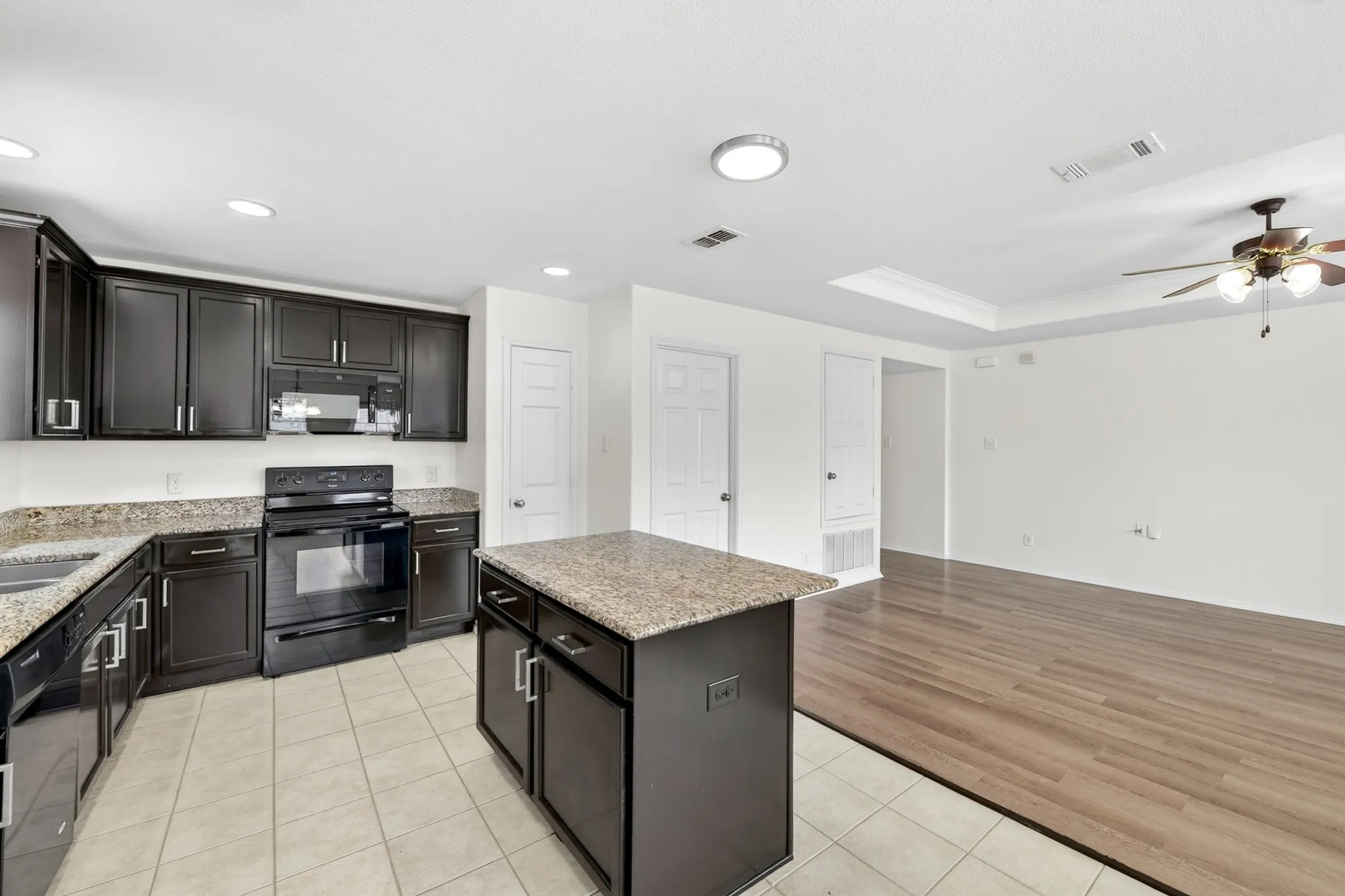 Kitchen is open to the living room for ease in entertaining or just hanging out