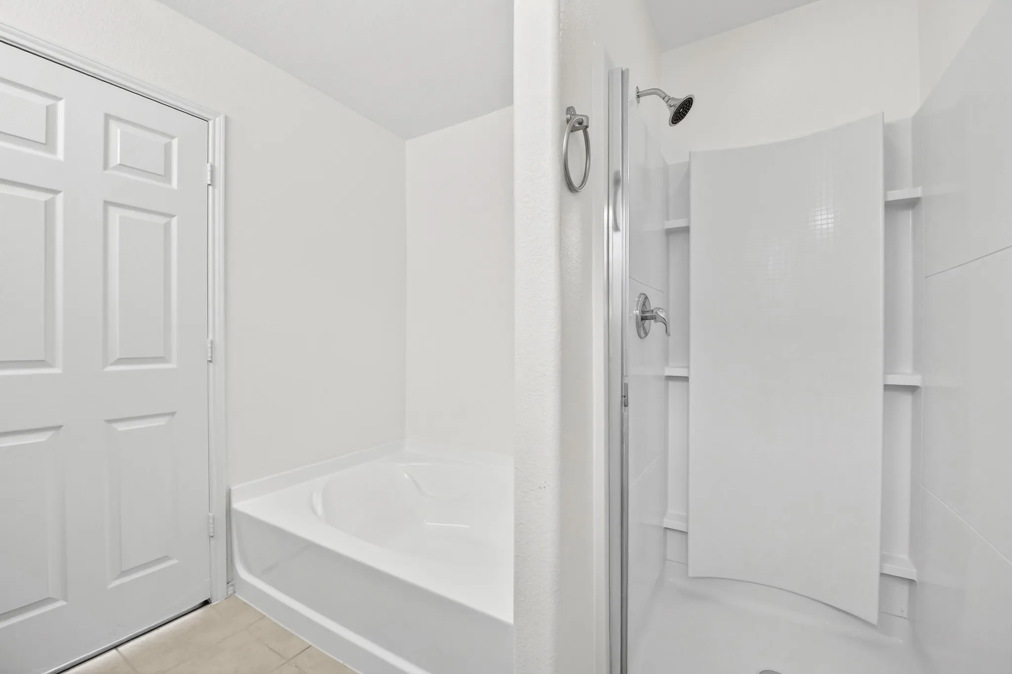 Primary bathroom with separate tub and walk in shower