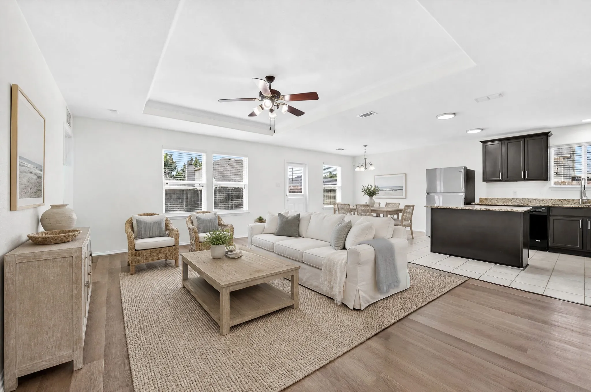 Virtually staged living that is open to the kitchen
