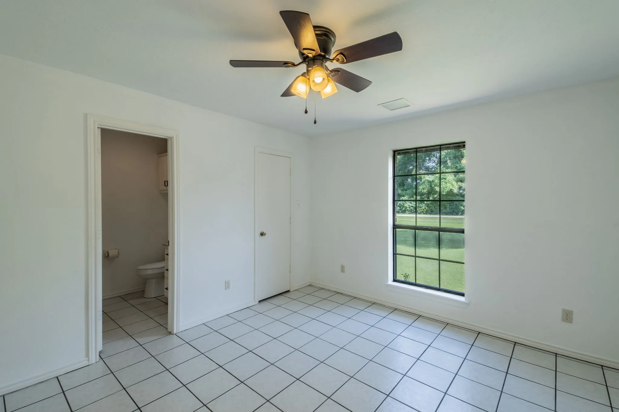 Guest Bedroom 1 featuring an ensuite bath, perfect for in-laws!