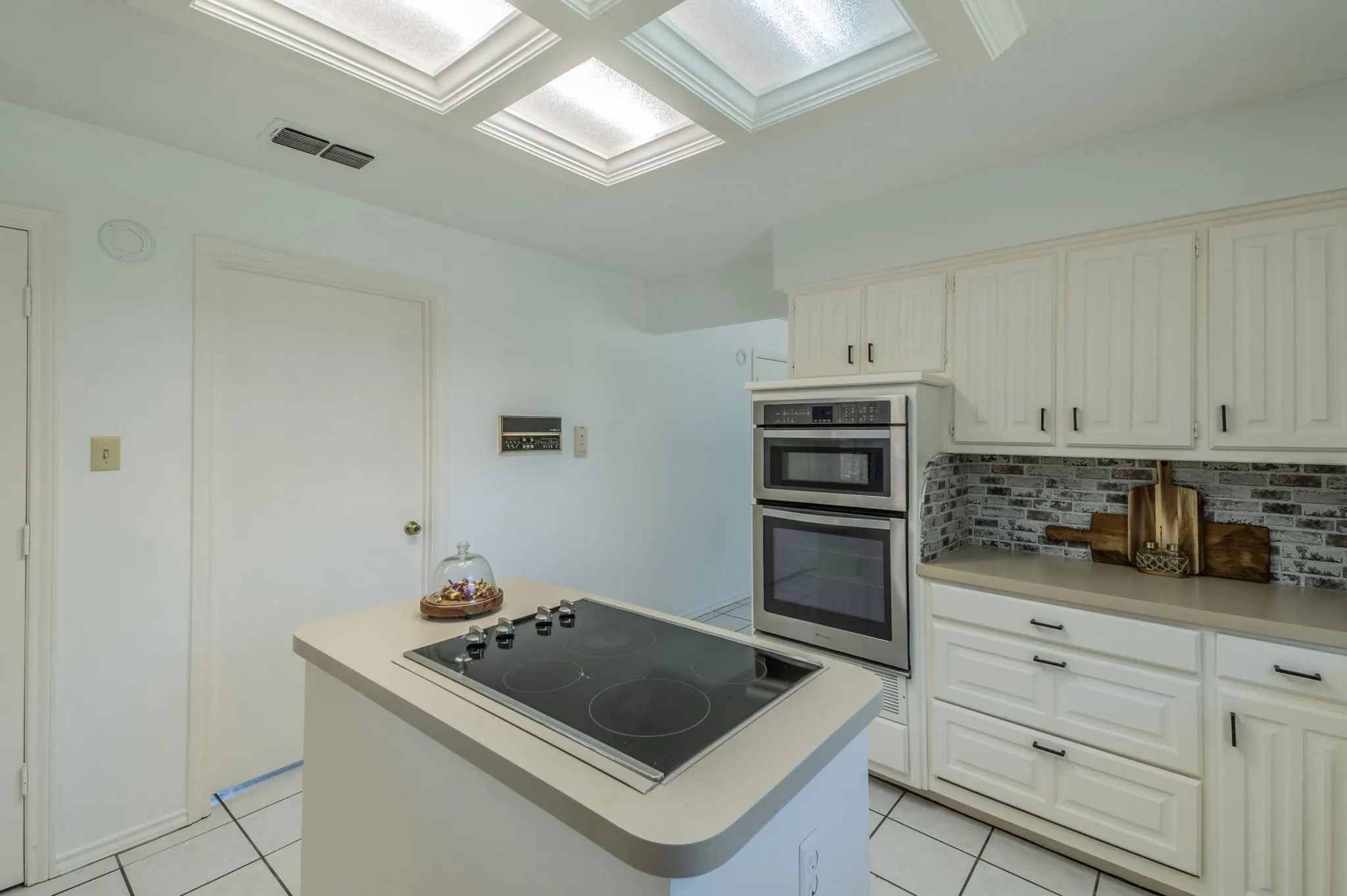 Another view of the kitchen with stainless steel applicance.