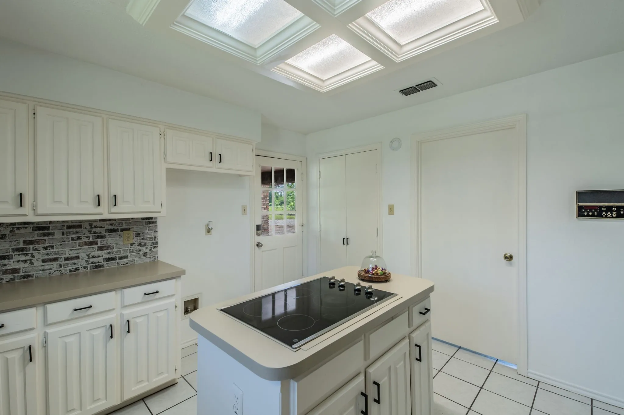Another view of the kitchen facing the double-door pantry.