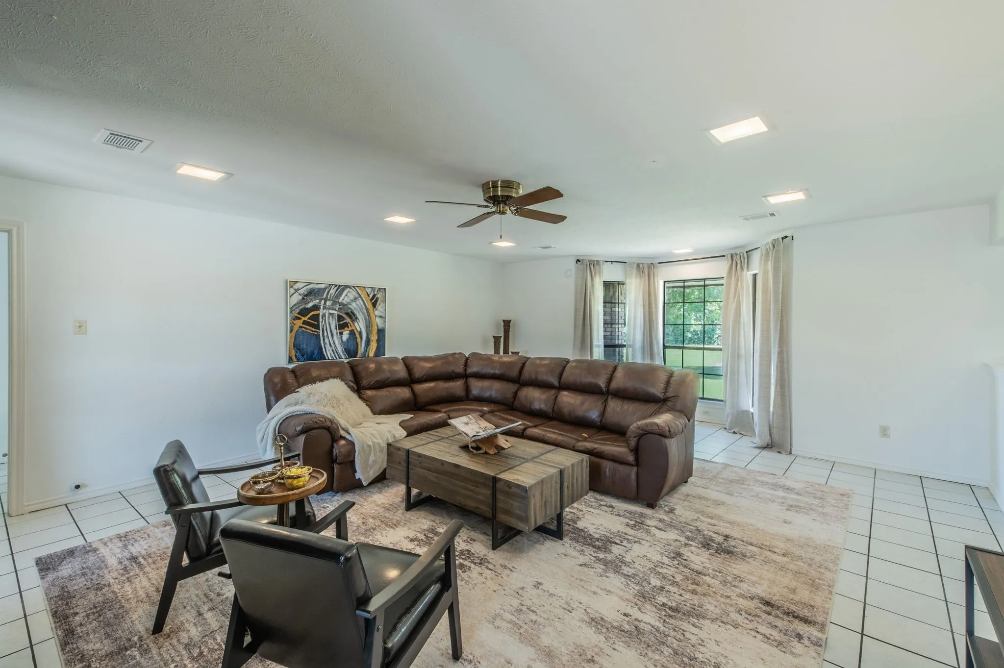 Another view of the living room featuring a bay window.