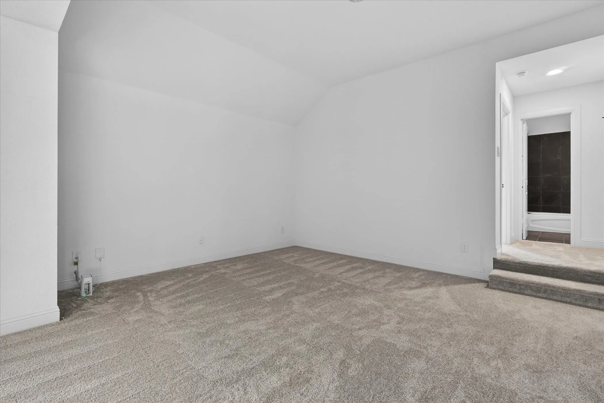 Spacious flex room offering endless possibilities, from a media room or playroom to a private home office or fitness space.