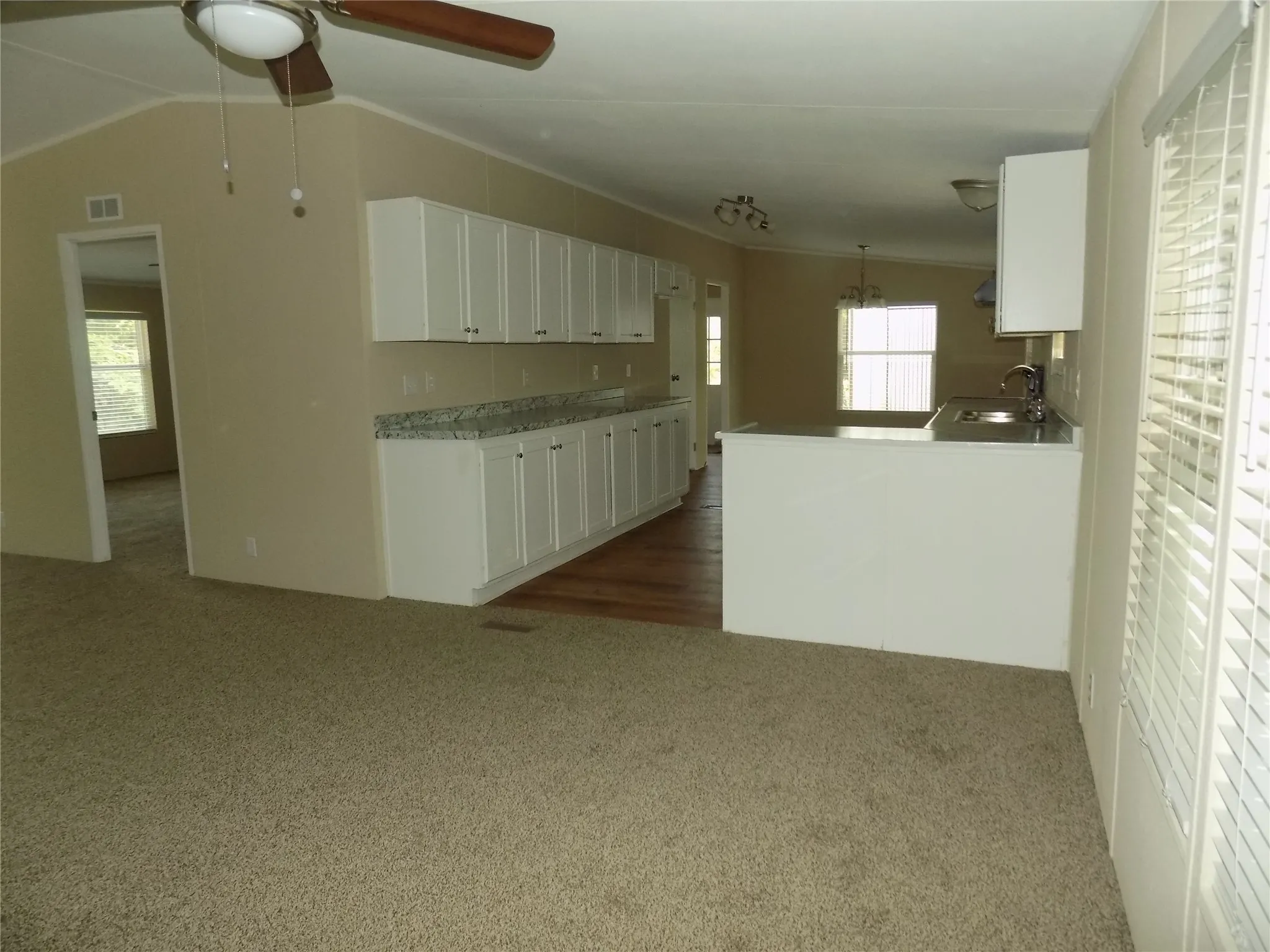 Looking into spacious kitchen with excellent cabinet space.