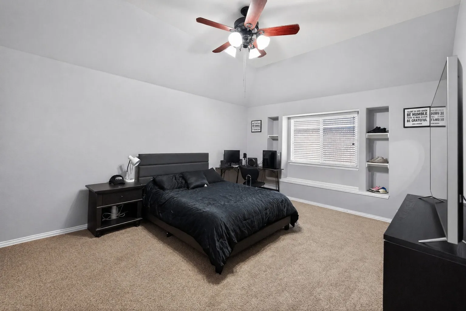 Upstairs - Bedroom # 4 featuring vaulted ceilings enhance this carpeted room featuring a ceiling fan with light fixture