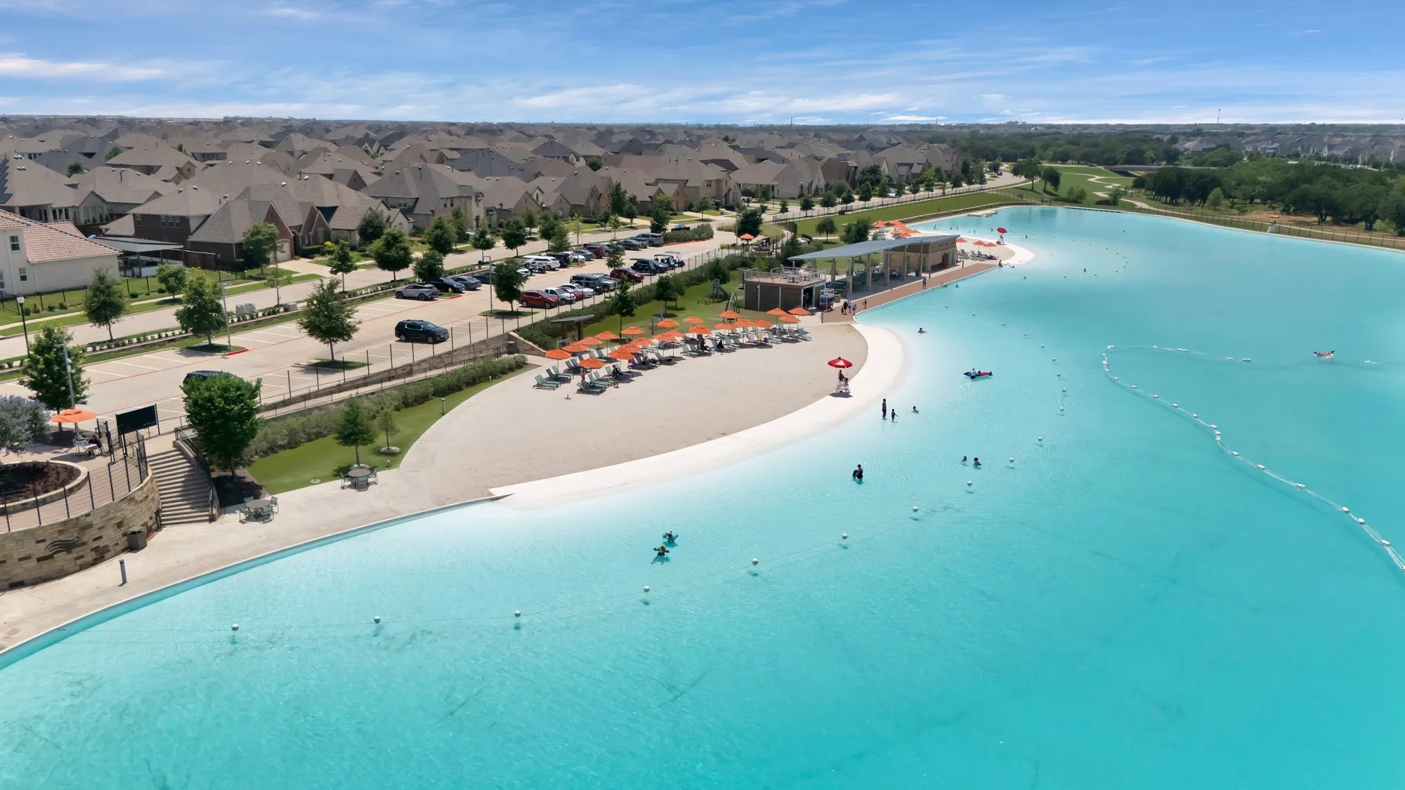 Expansive lagoon with a sandy beach entry and swimming