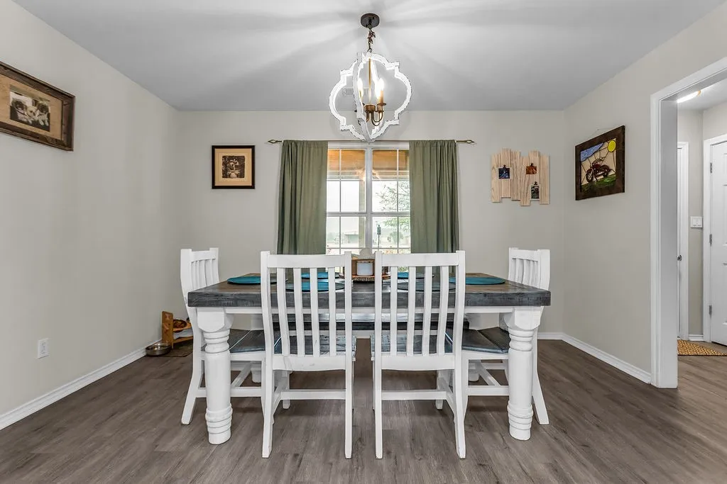 Dining area featuring wood-finish flooring and neutral wall tones