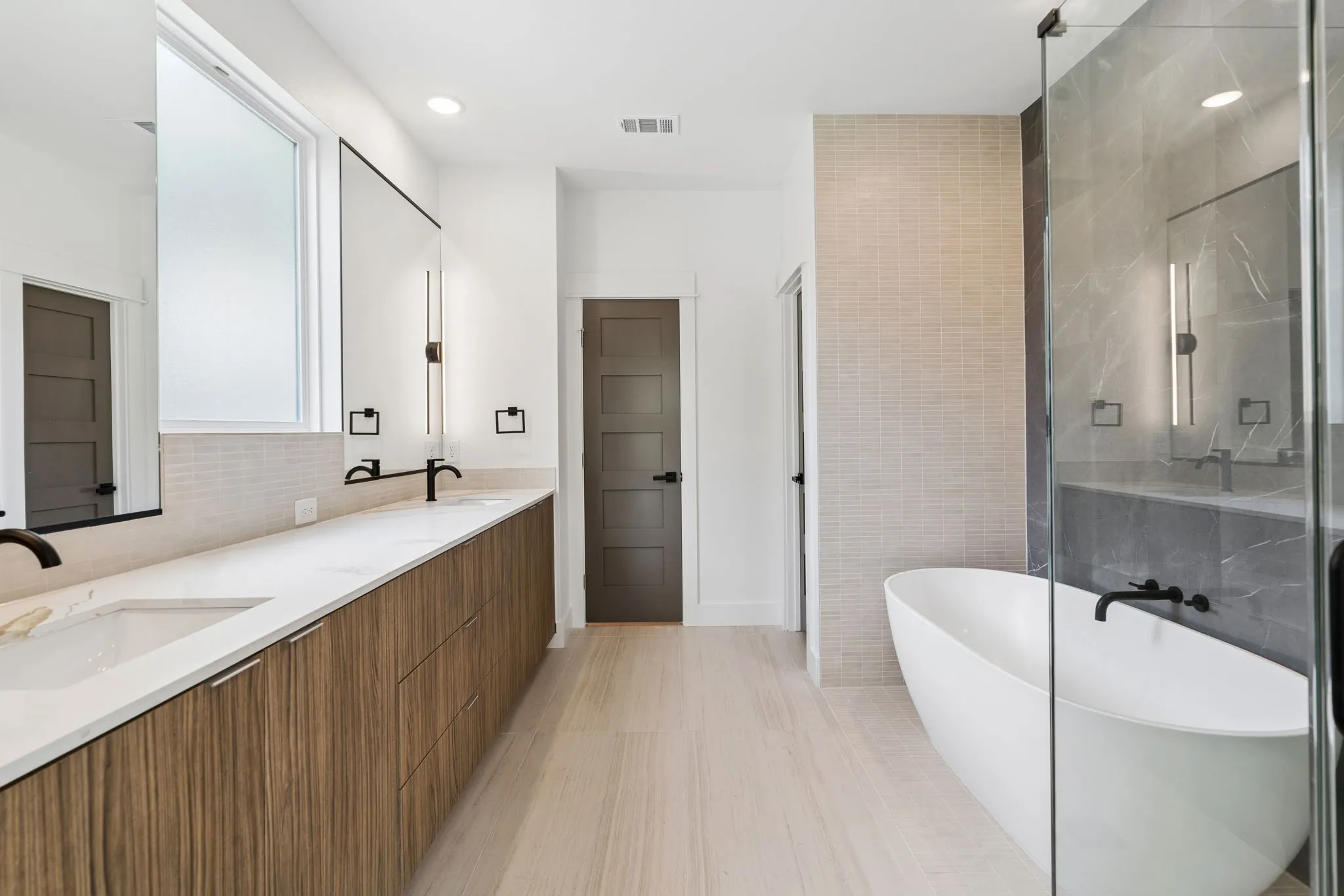 Primary bathroom with soaking tub and separate walk in shower.