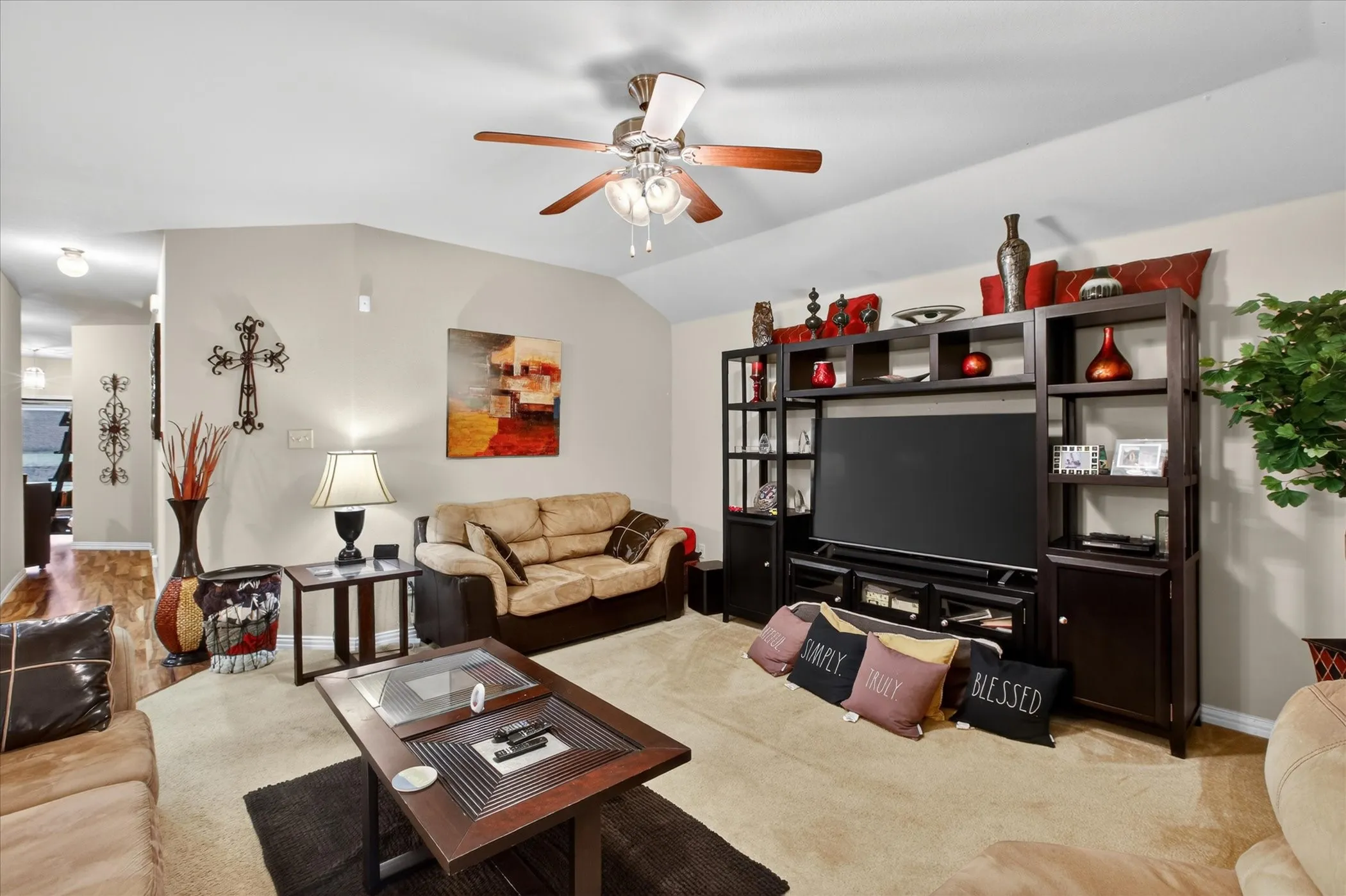 Living area featuring vaulted ceilings, recessed lighting, a ceiling fan, and carpeted flooring