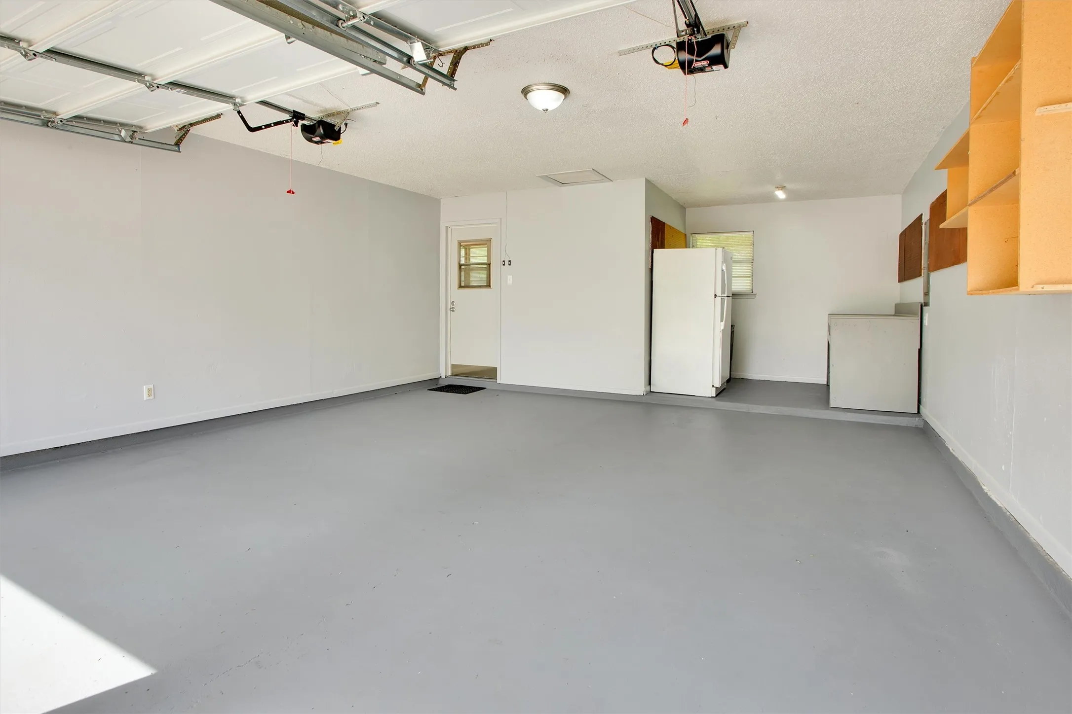 Alley entry rear garage with extra storage/work space with a beverage refrigerator included!