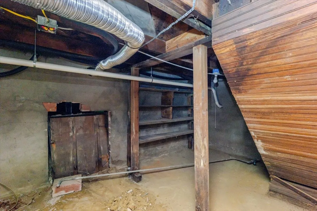 Stairway covered by kitchen island