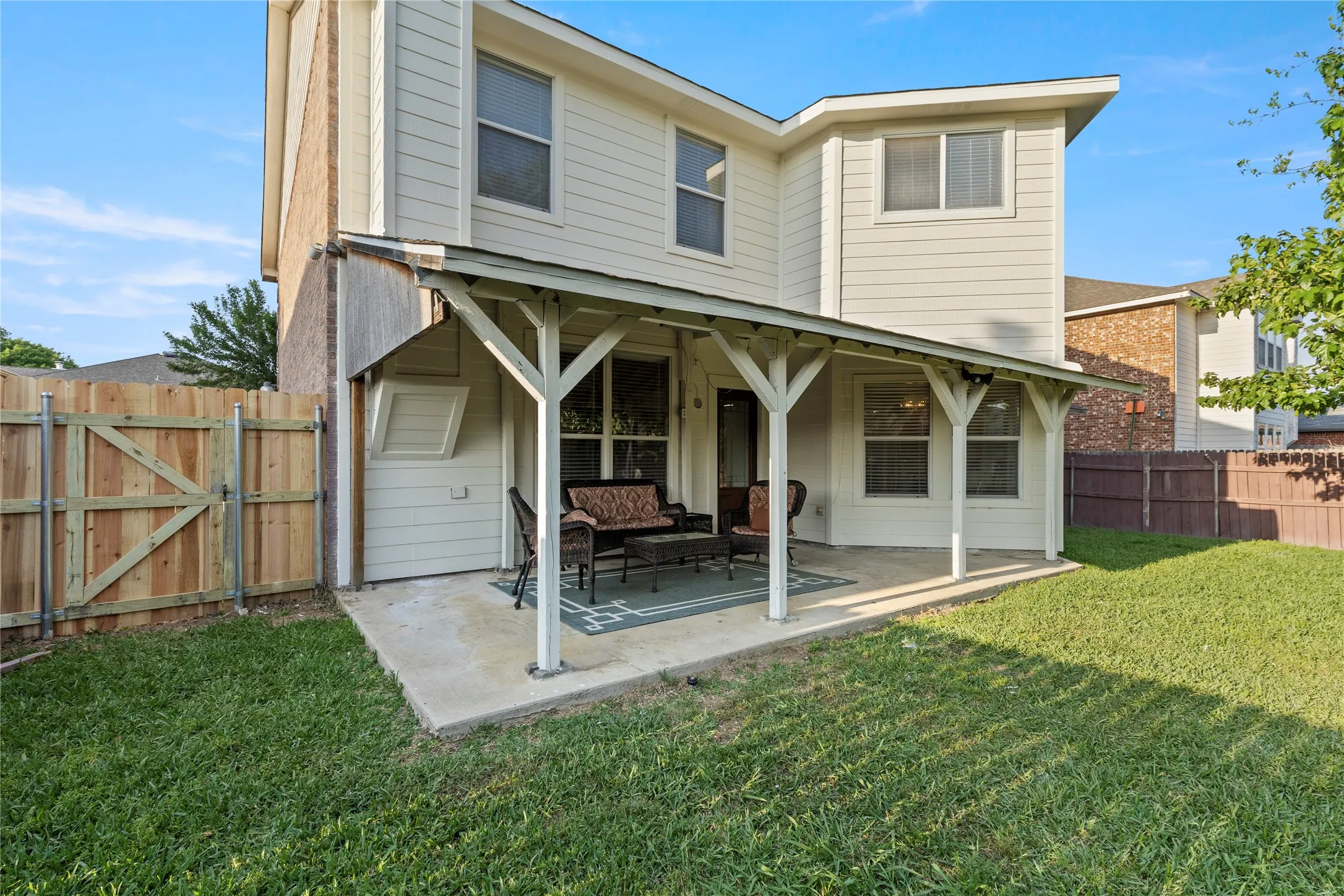 Covered patio featuring a concrete slab and direct access to the backyard
