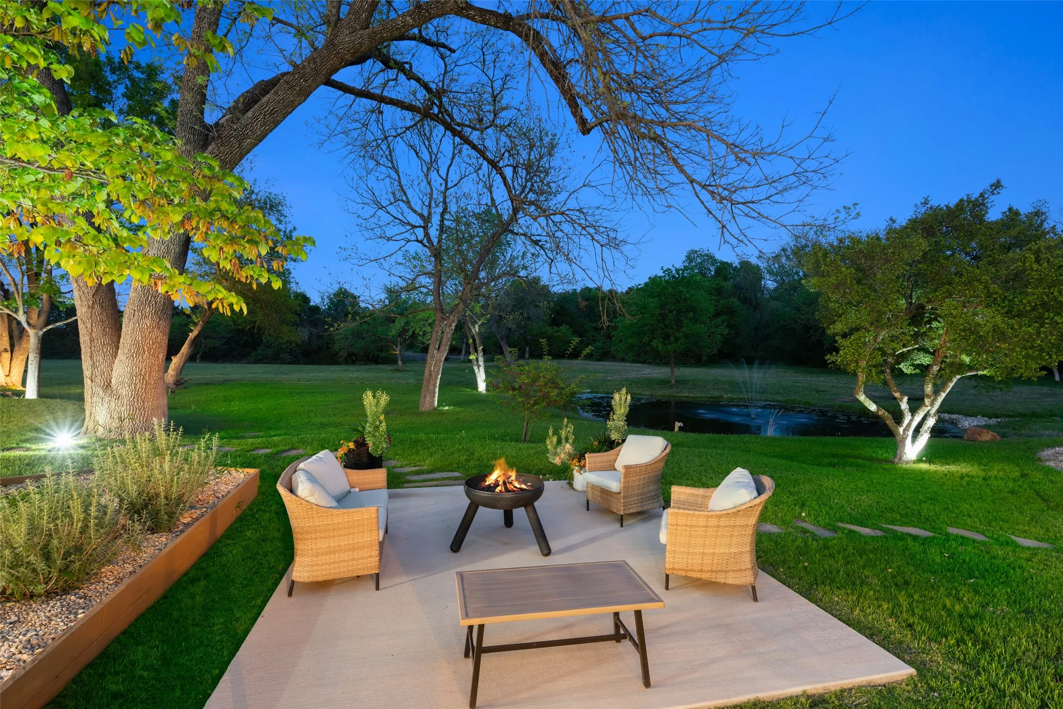Outdoor living or dining area overlooks pond