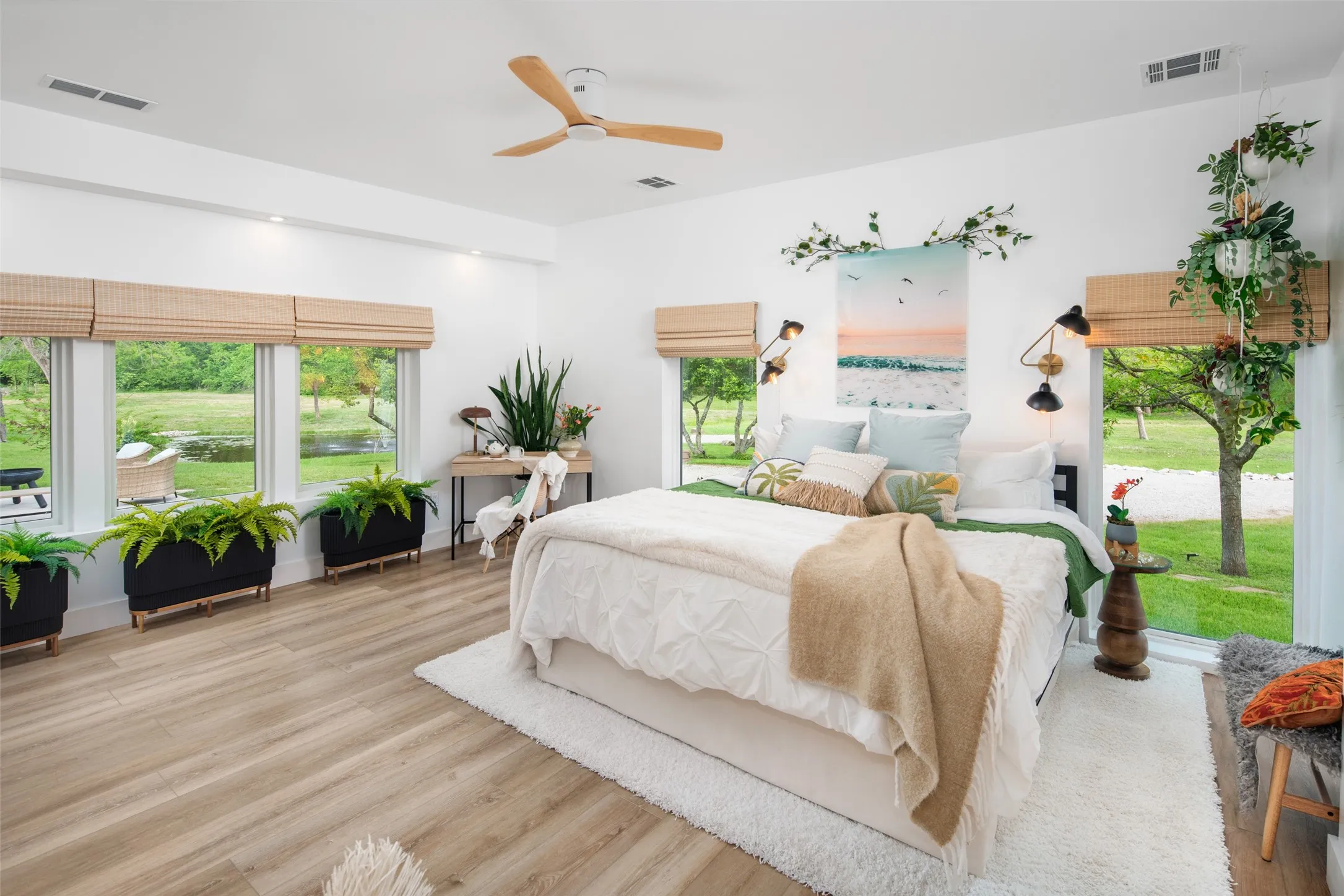 Natural light floods the primary bedroom plus linear fireplace adds cozy