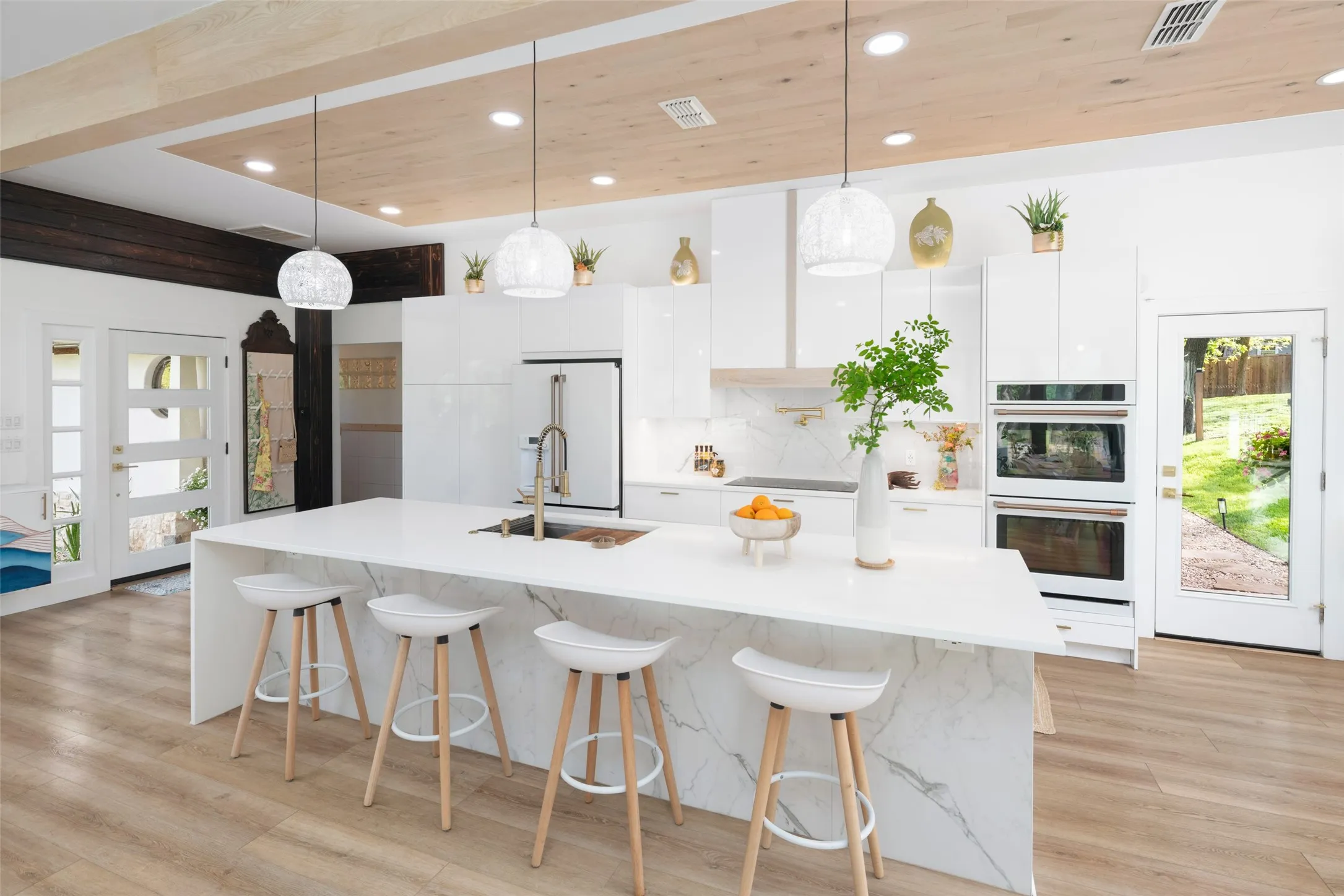 Double ovens with air fry feature and a pot filler over the induction stovetop