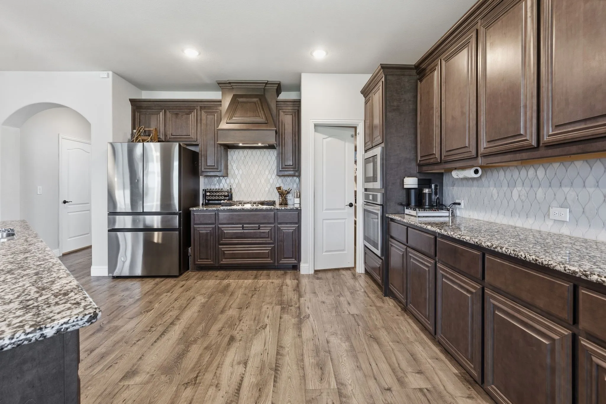 A giant walk-in pantry is at the corner of the kitchen.  And look at the space in this kitchen!