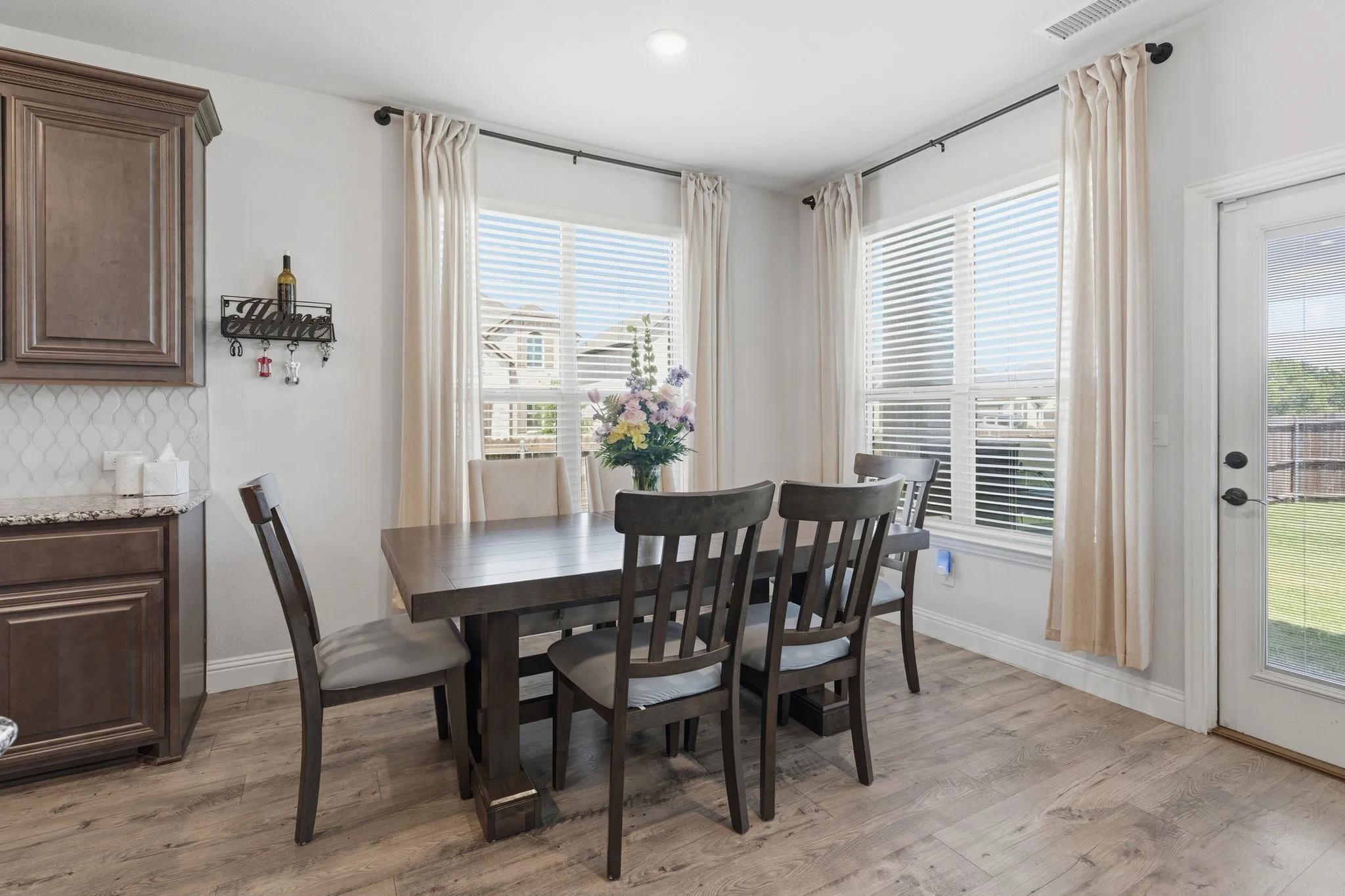 This dining space is large enough to accommodate furniture for day to day meals or larger gatherings.