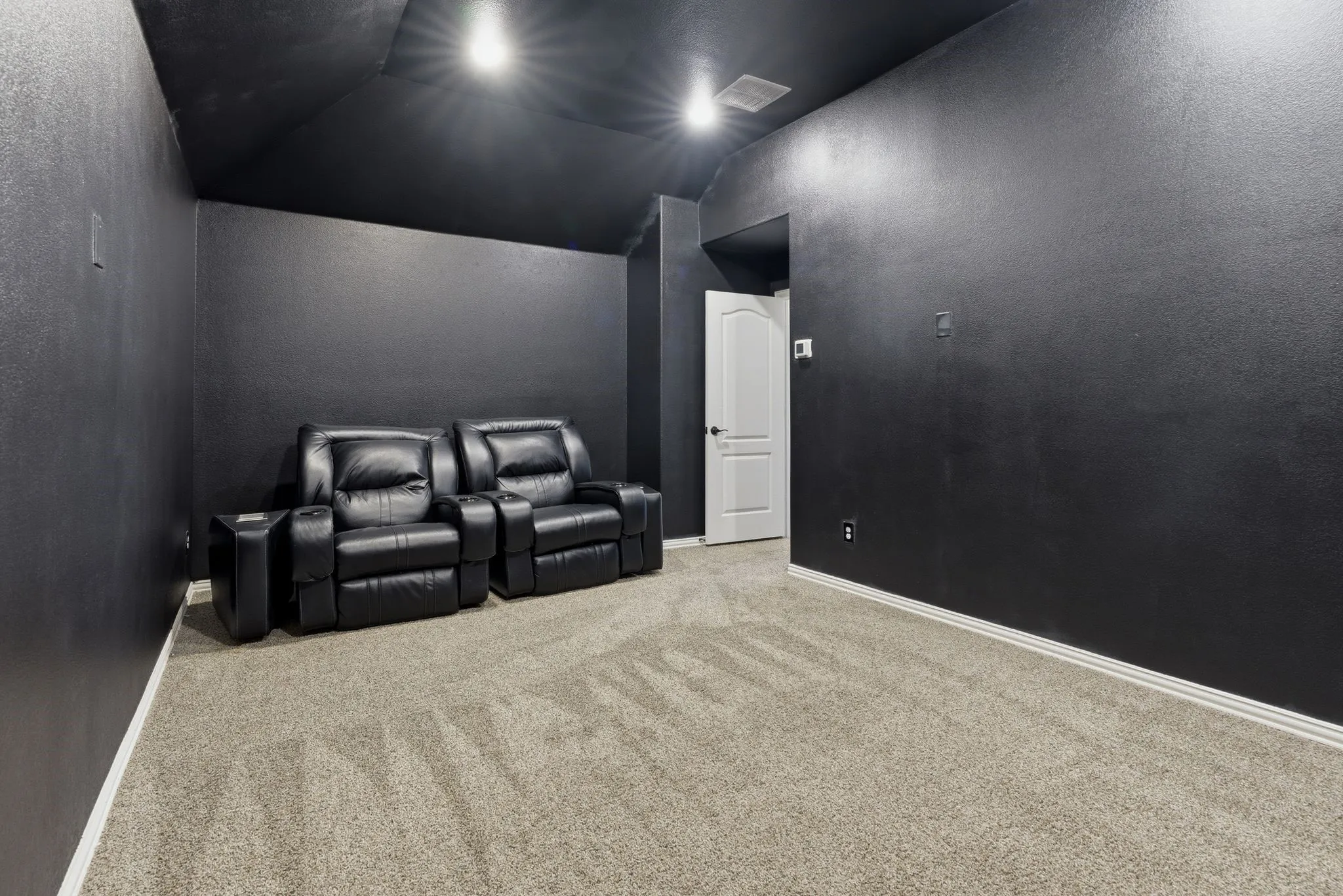 Media room upstairs tucked away at the end of the hallway.  Escape to watch movies, sports or your favorite shows.
