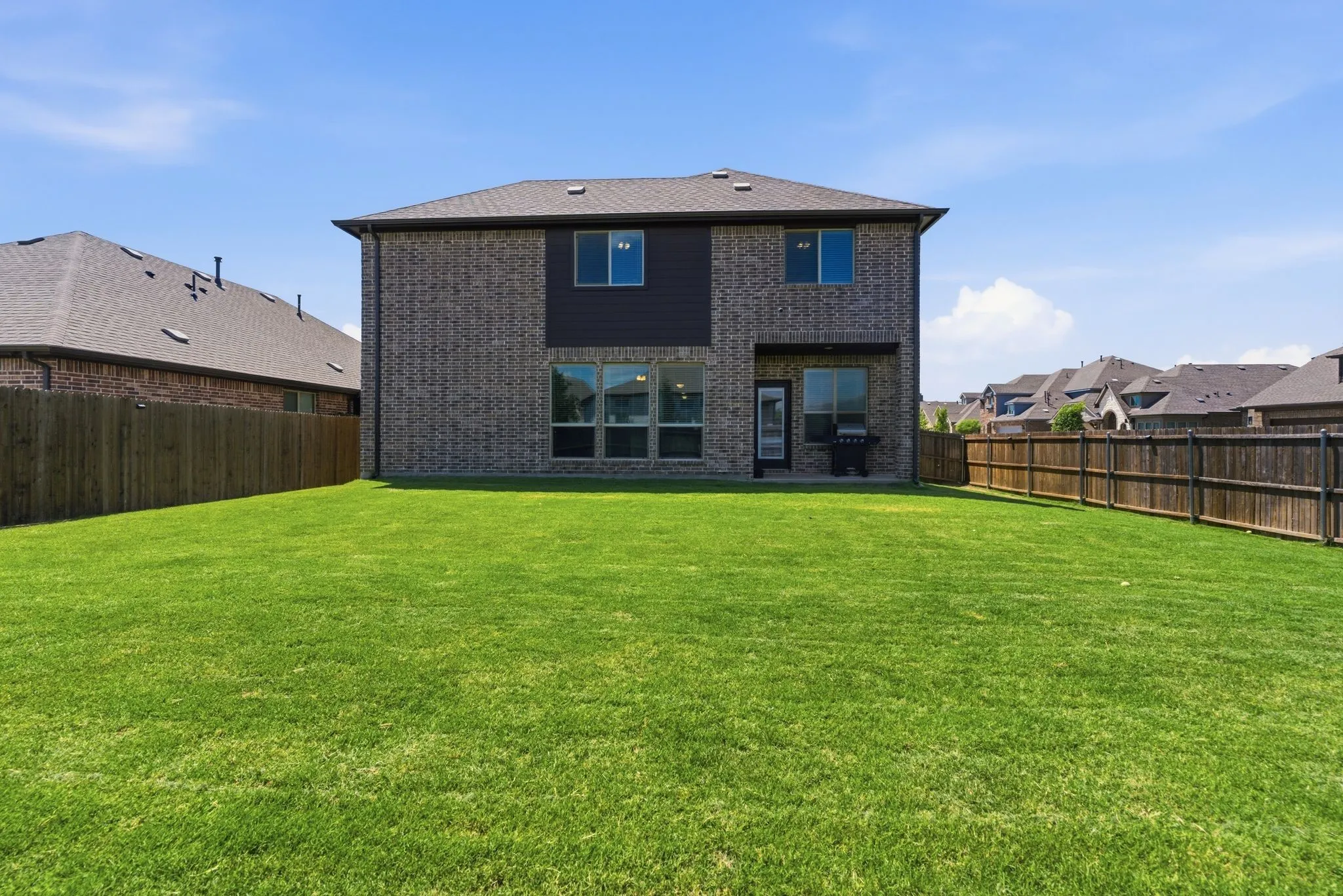 Covered patio, fully fenced and manicured backyard to enjoy!