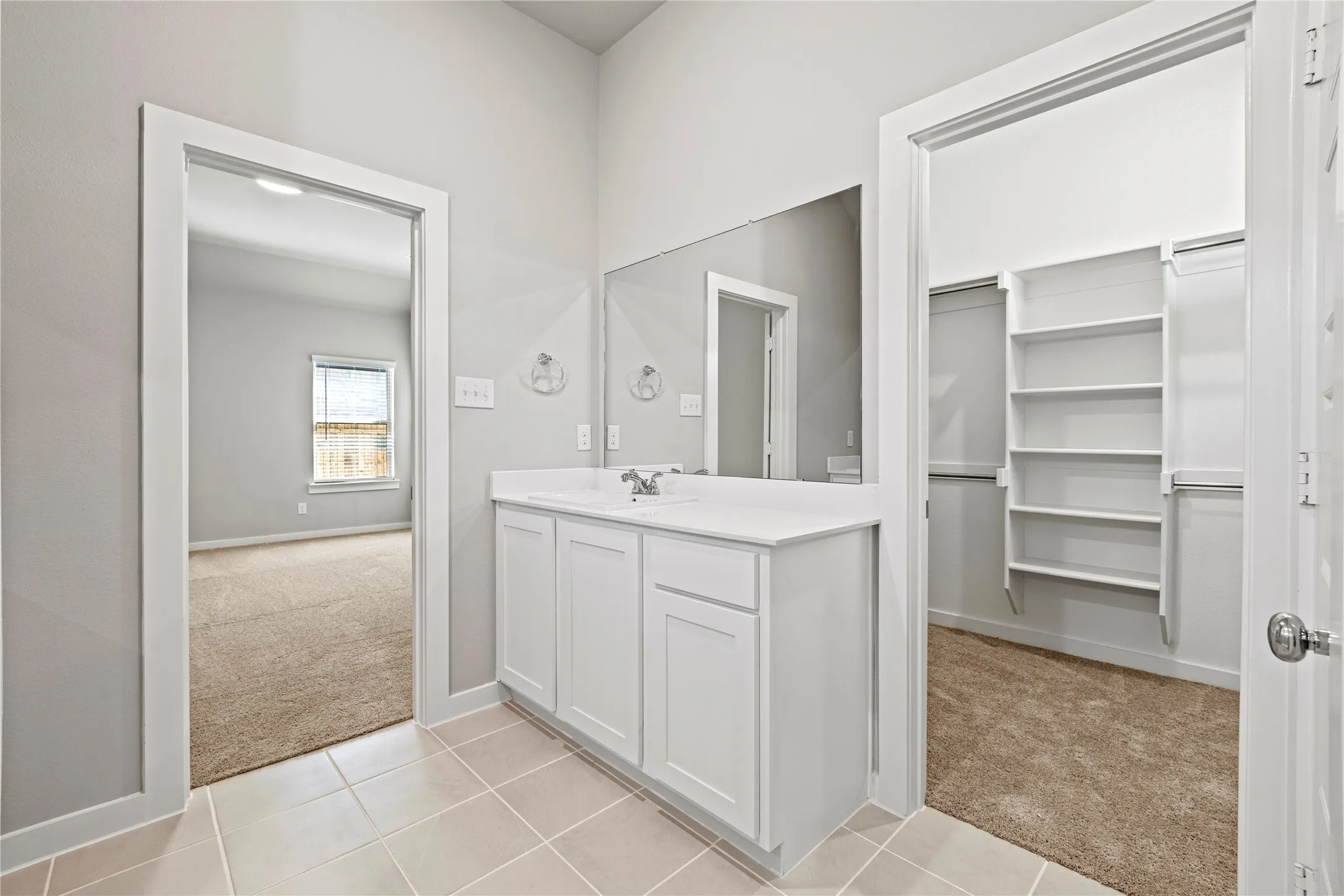 Bathroom with tile flooring and vanity