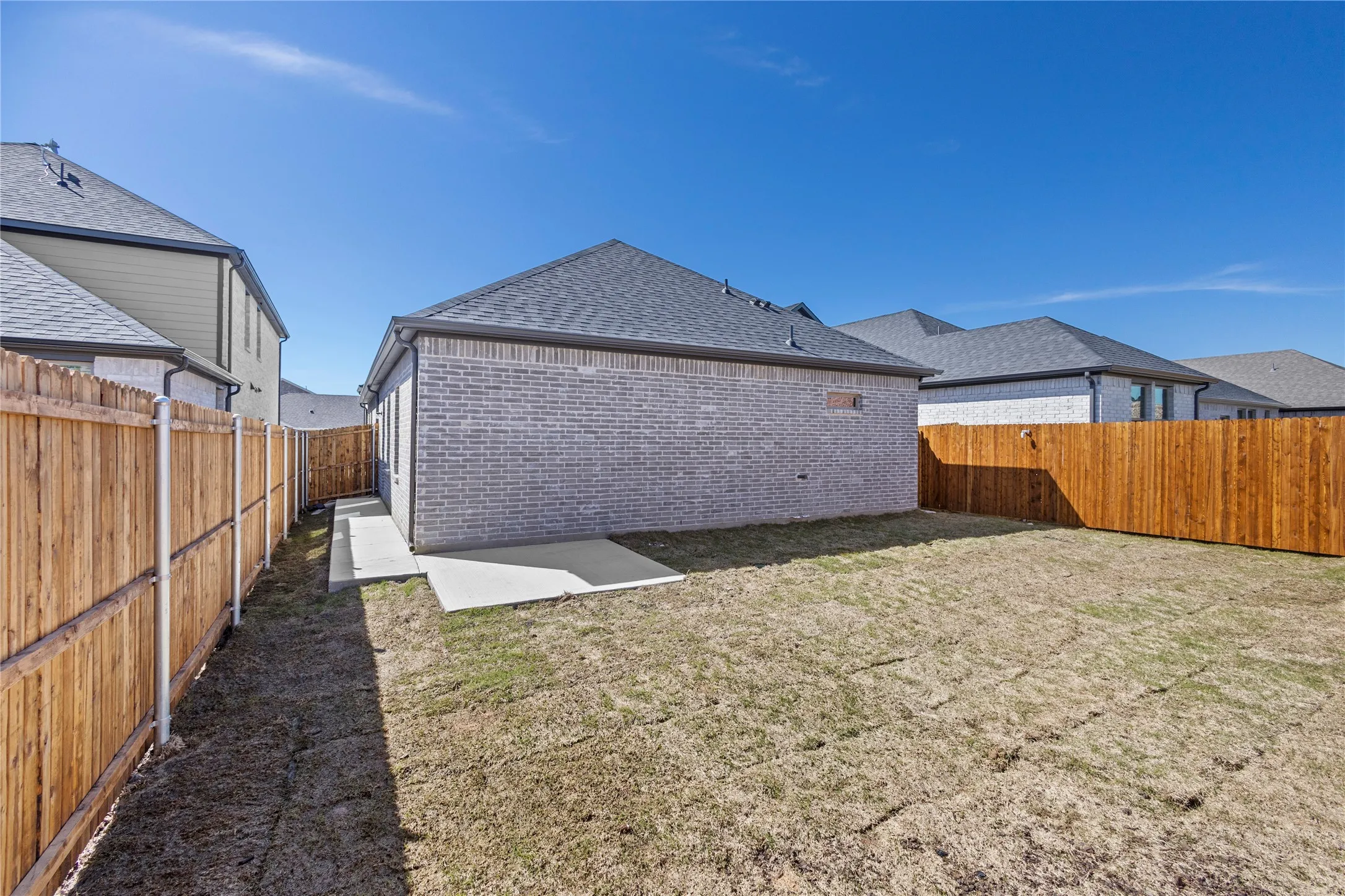 Back of house featuring a yard