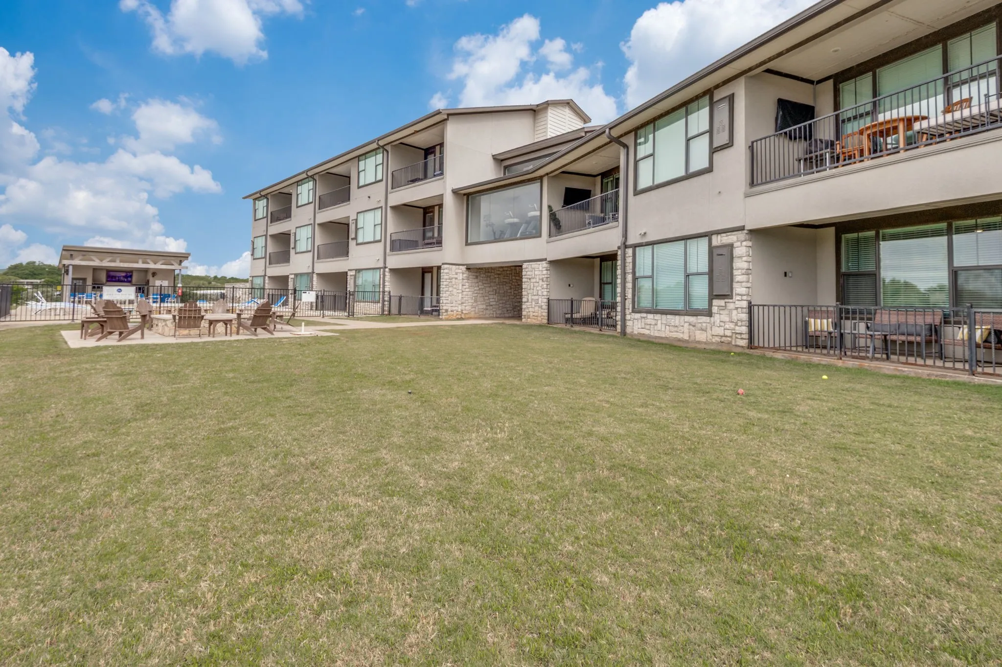 This condo has ample yard space in front of the patio.  Great for games of cornhole.