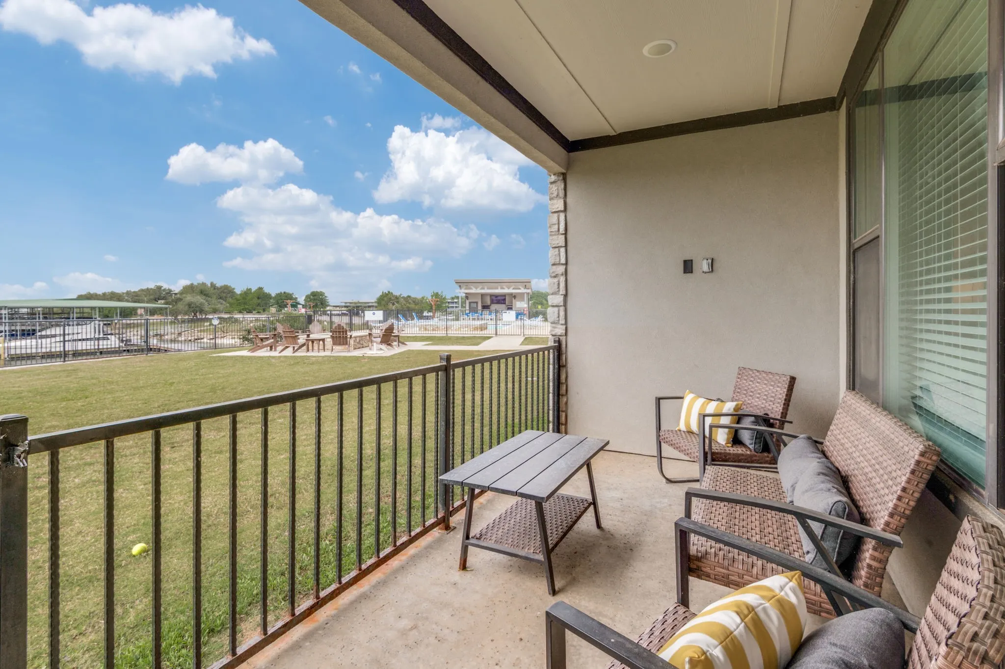 1st floor patio overlooking the lake and pool