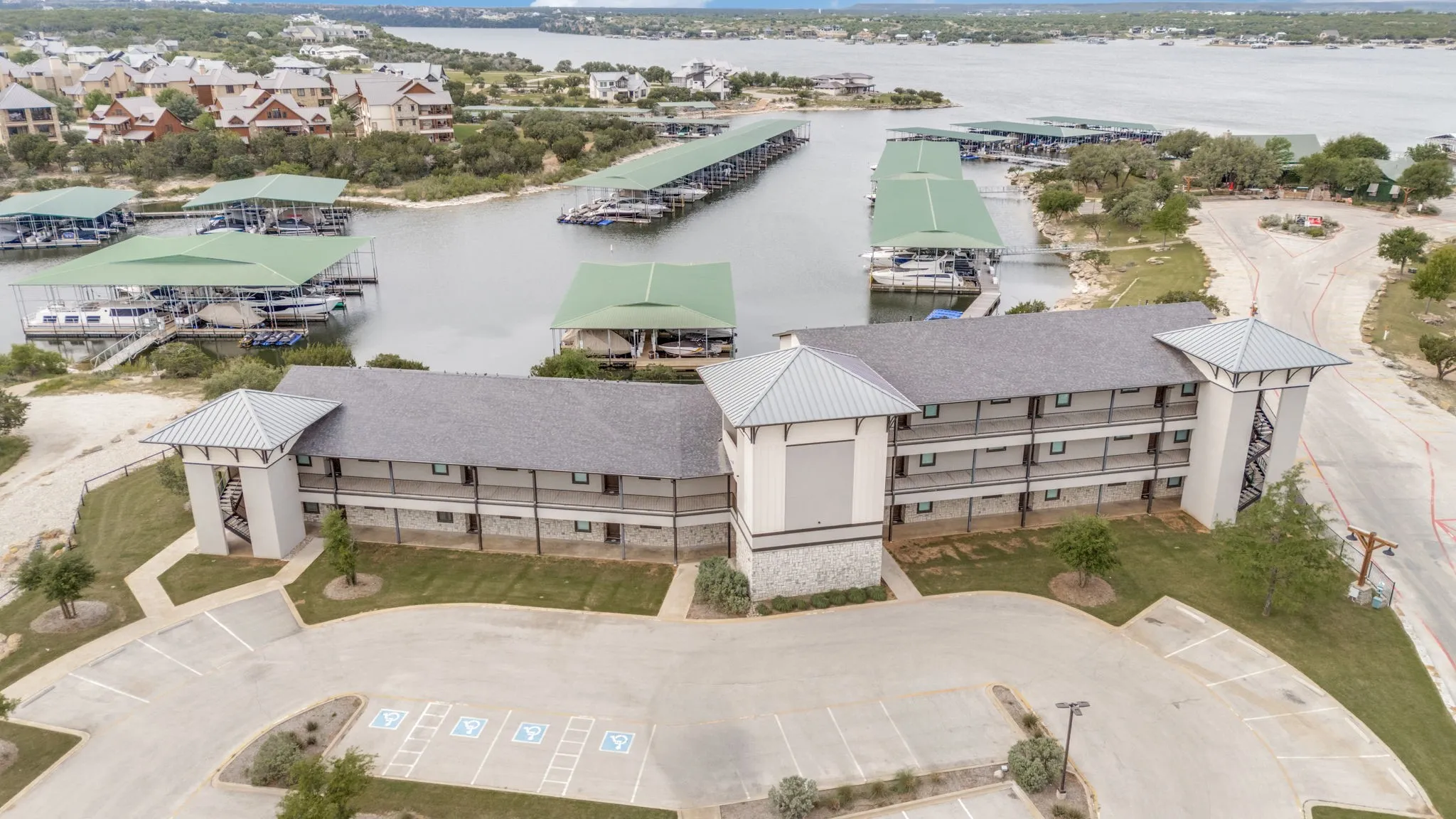 Aerial showing the condo, marina and water