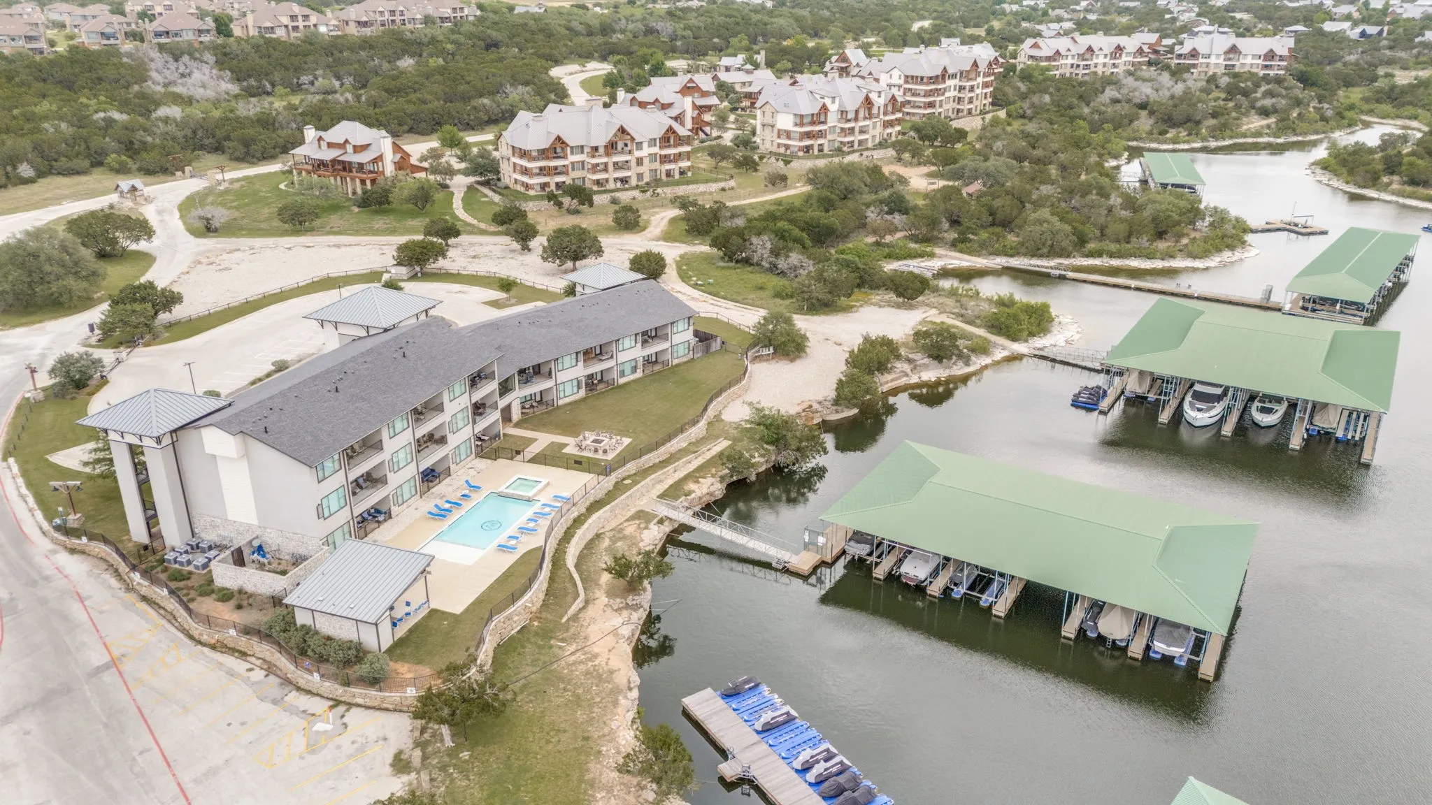 Aerial showing the condo, marina and water
