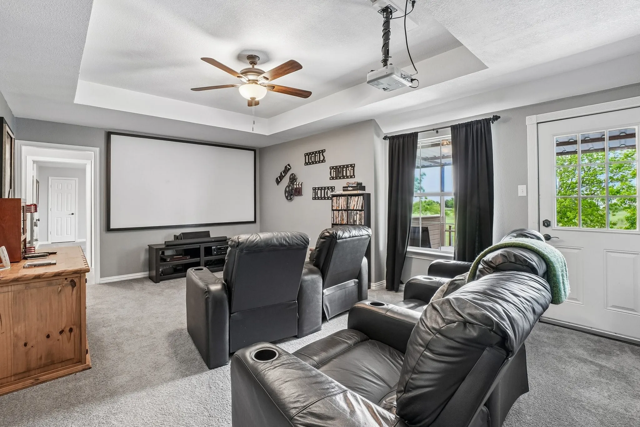 Media room upstairs with balcony access.