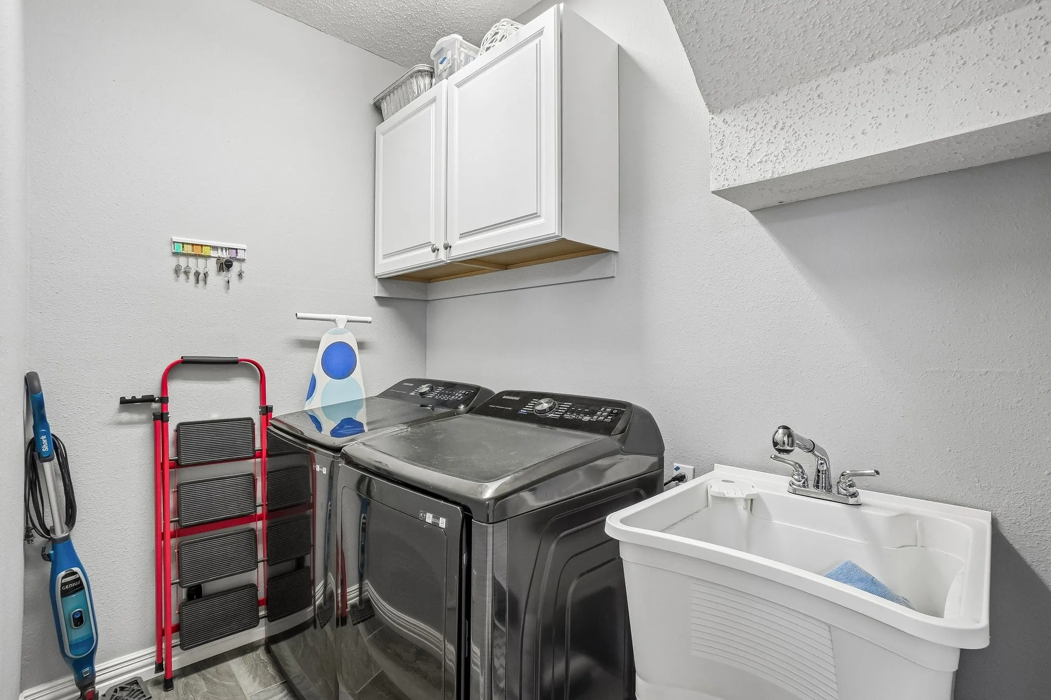 Laundry room with utility sink.