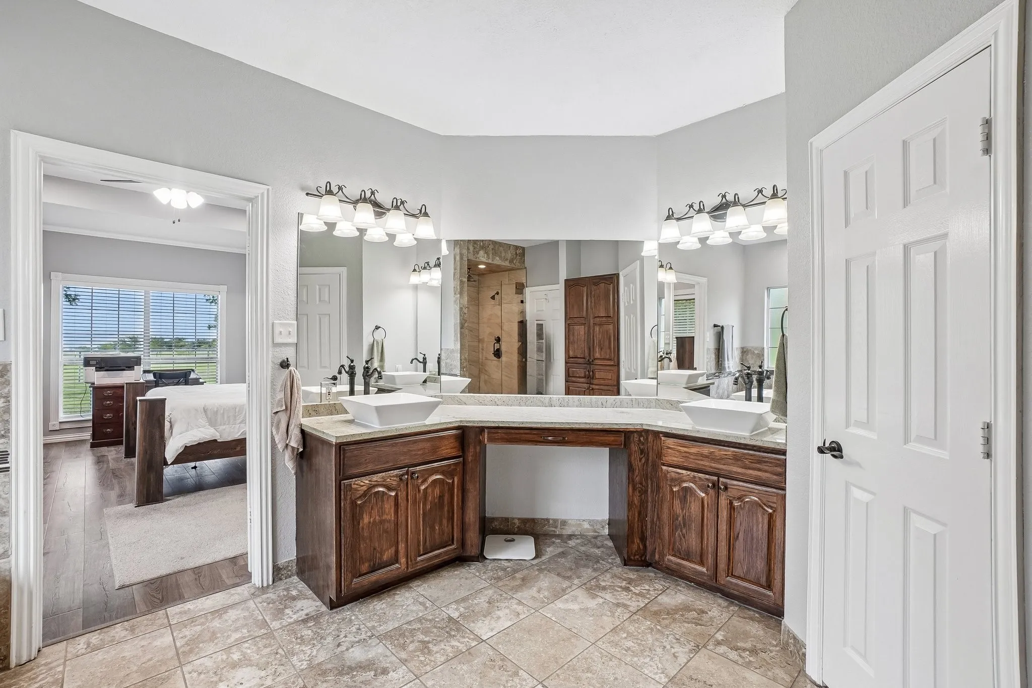 Primary bathroom featuring dual sinks with ample counter space and a functional layout.