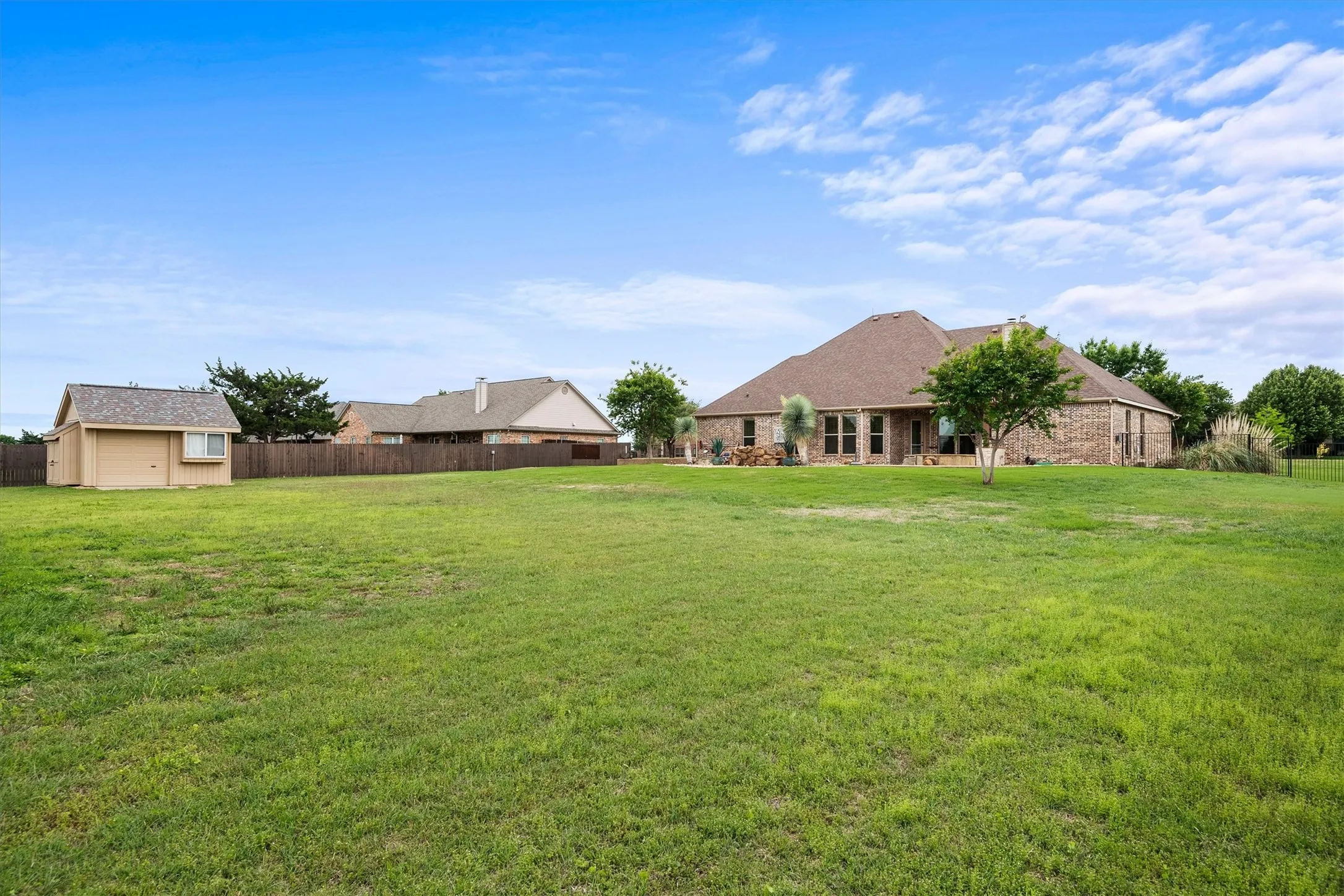 Expansive green lawn providing ample outdoor space