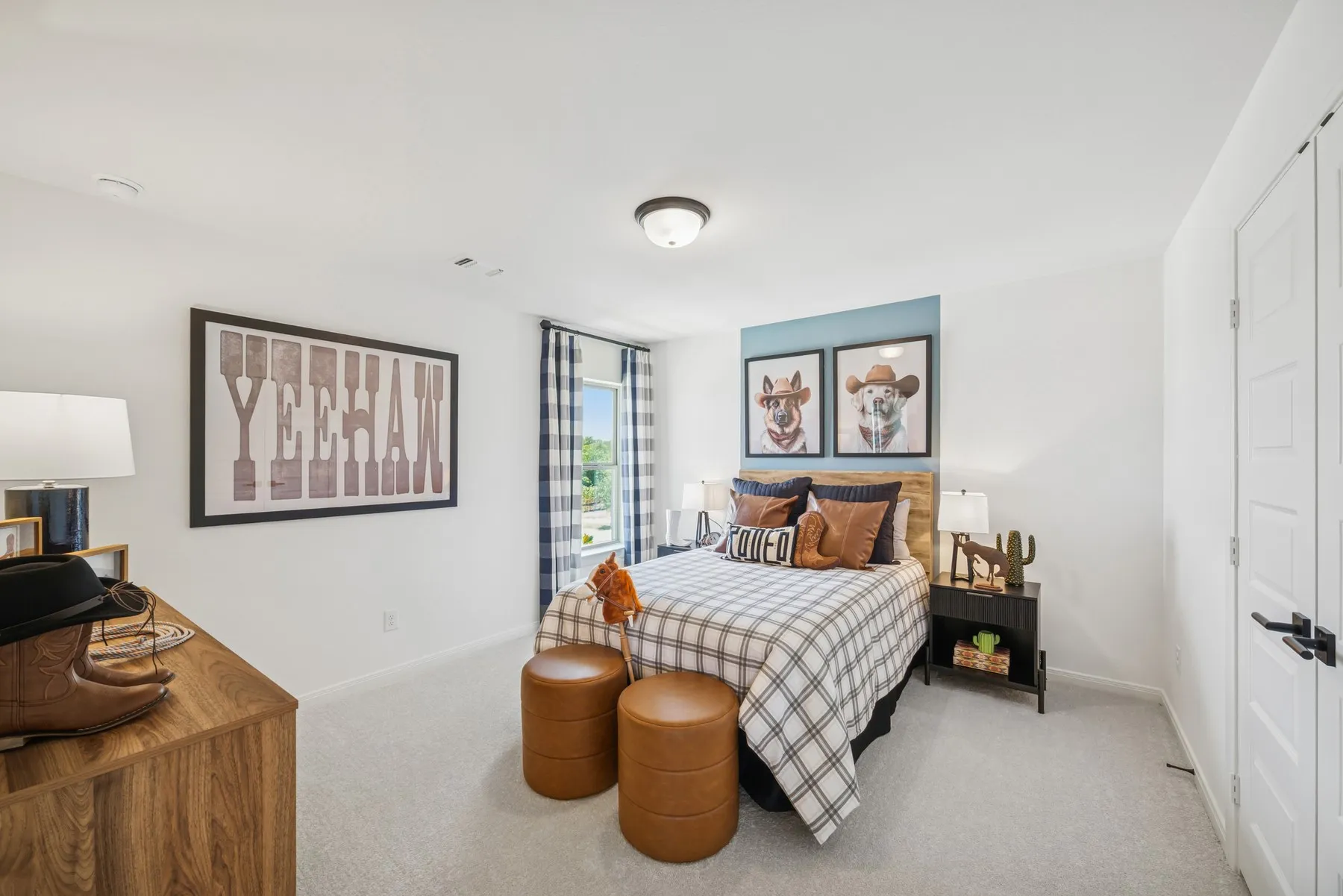 Bedroom with light gray carpeting and white walls