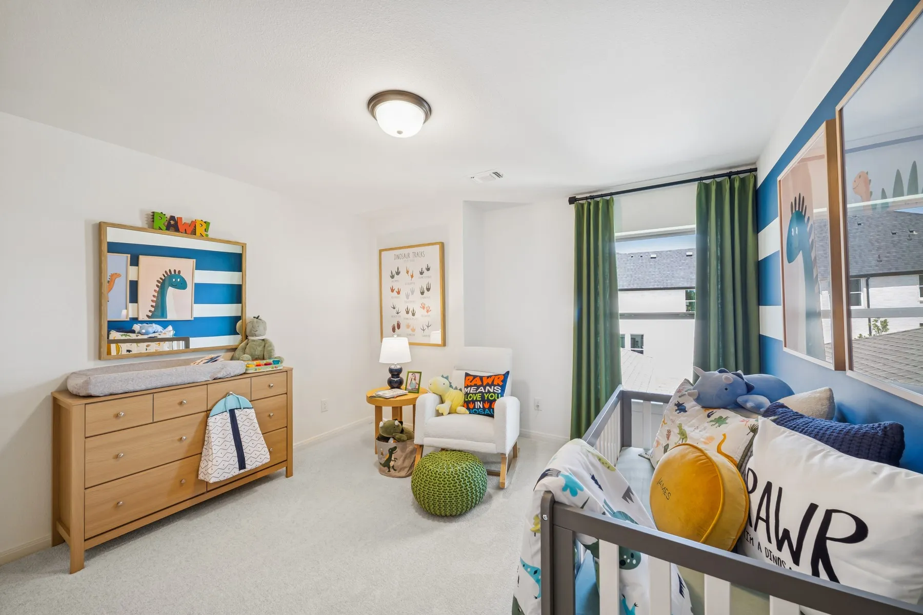 Bright interior space featuring white walls and light-colored carpeting