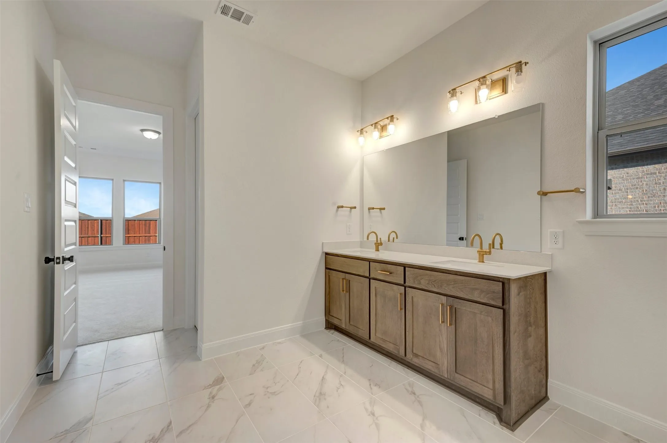Dual vanity with stone countertop and integrated sinks