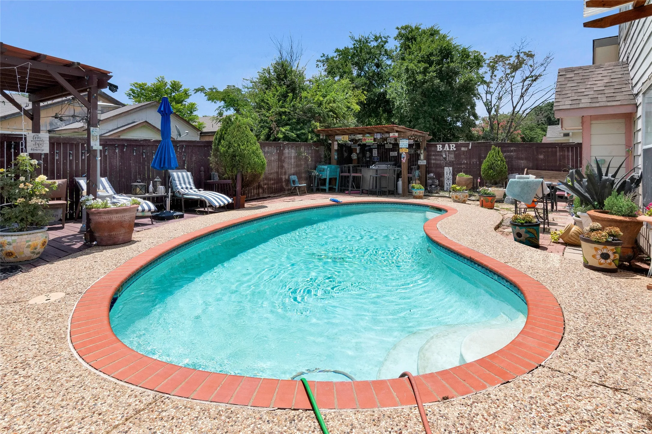 View of pool featuring a pergola