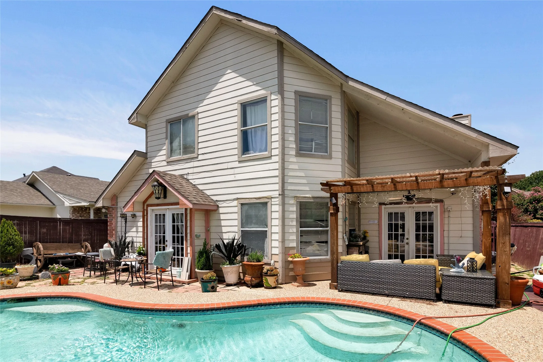 View of swimming pool with a pergola, a patio area, french doors, and ceiling fan