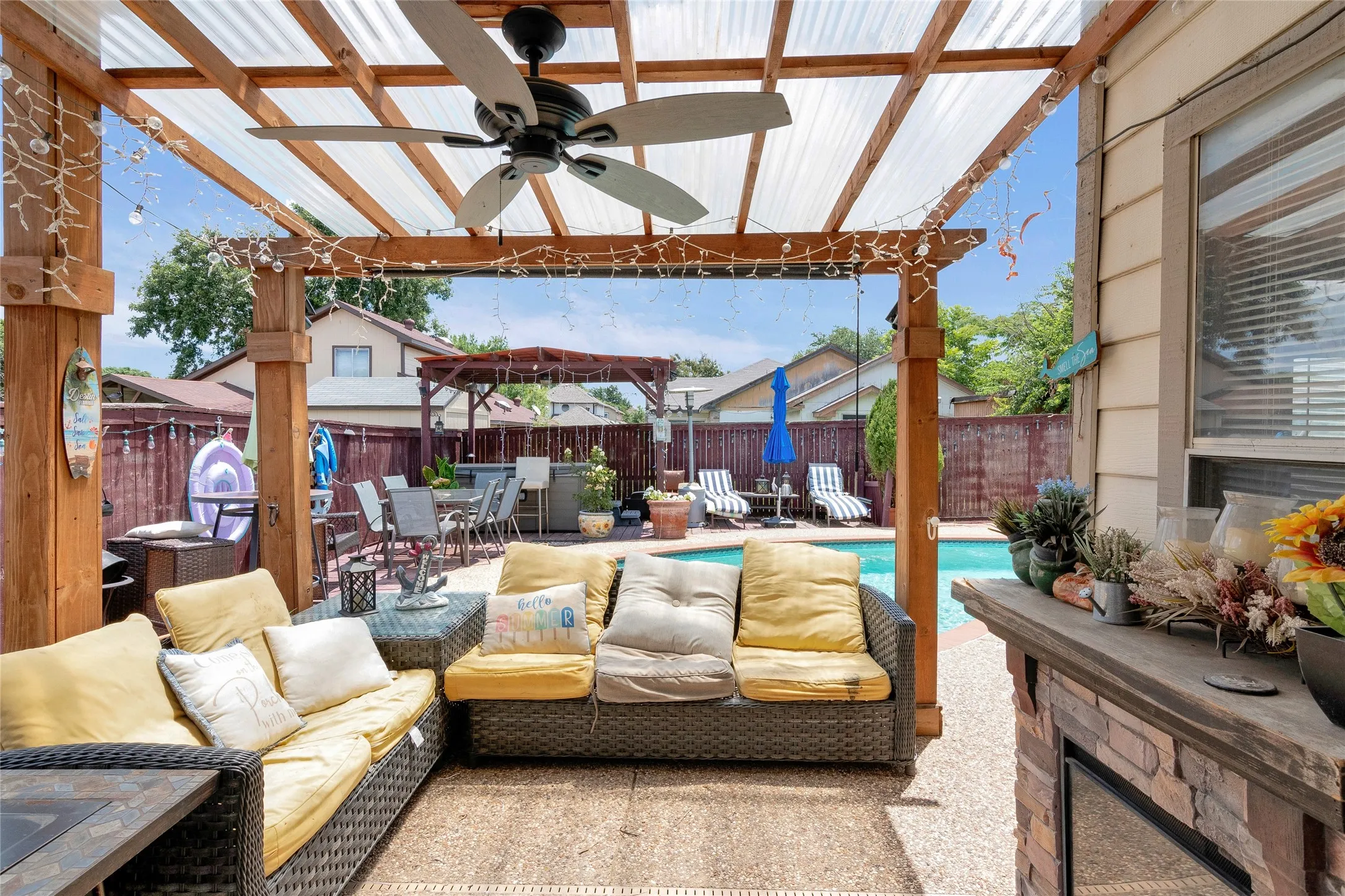 View of patio / terrace featuring ceiling fan, an outdoor hangout area, a pergola, and a fenced in pool