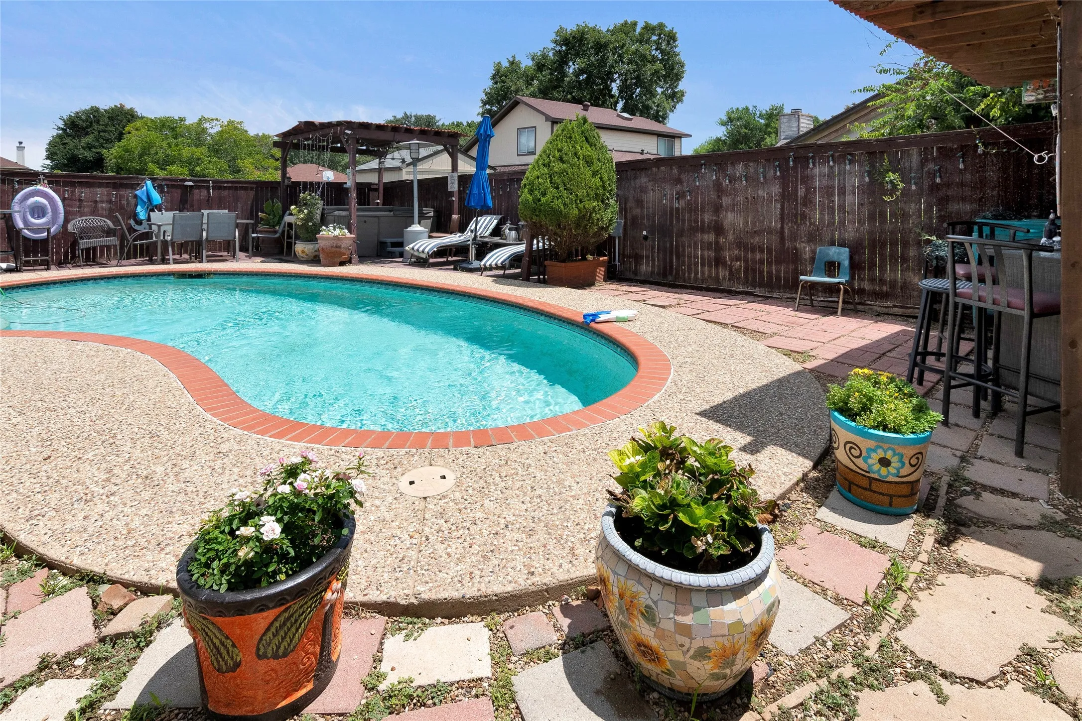 View of swimming pool with a patio